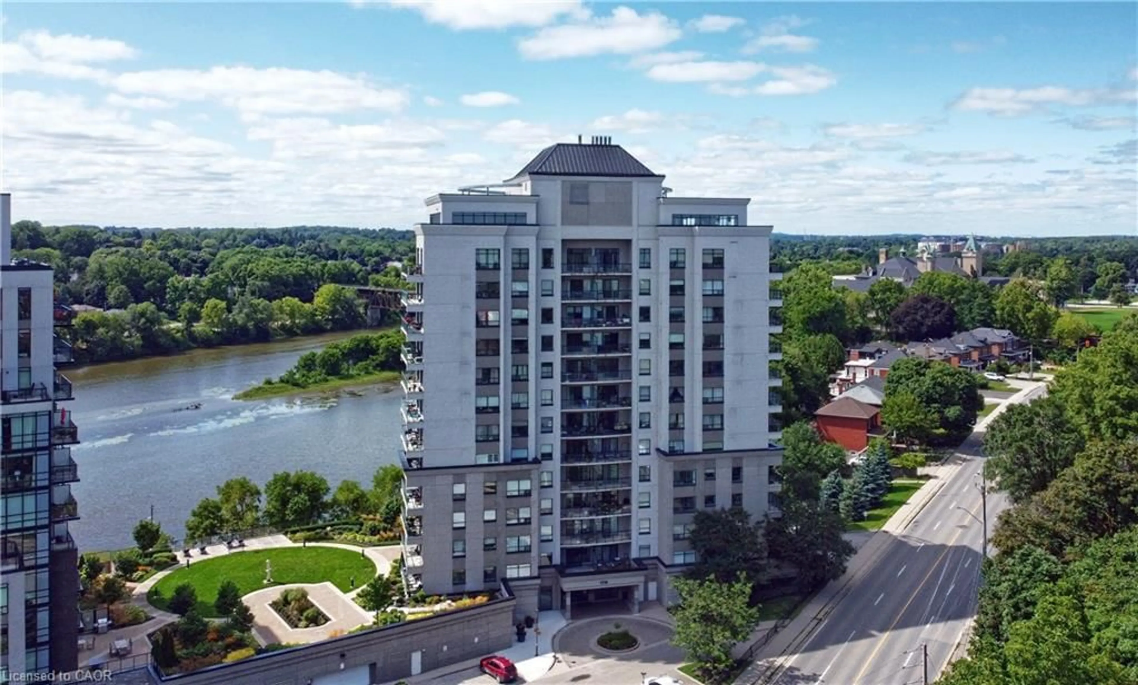 A pic from outside/outdoor area/front of a property/back of a property/a pic from drone, water/lake/river/ocean view for 170 Water St #308, Cambridge Ontario N1R 3B6