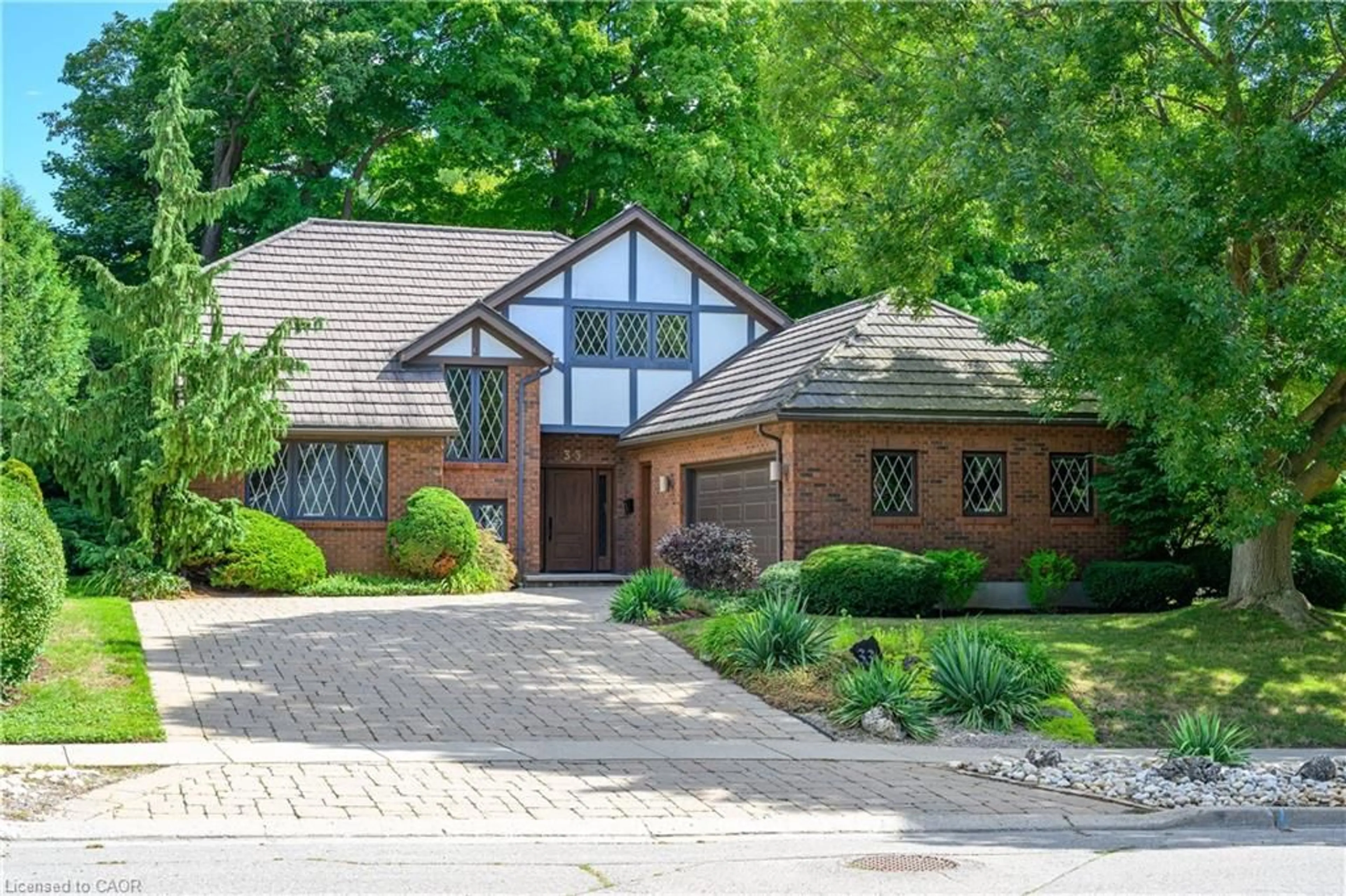 Home with brick exterior material, street for 33 Walnut Dr, Guelph Ontario N1E 4B4
