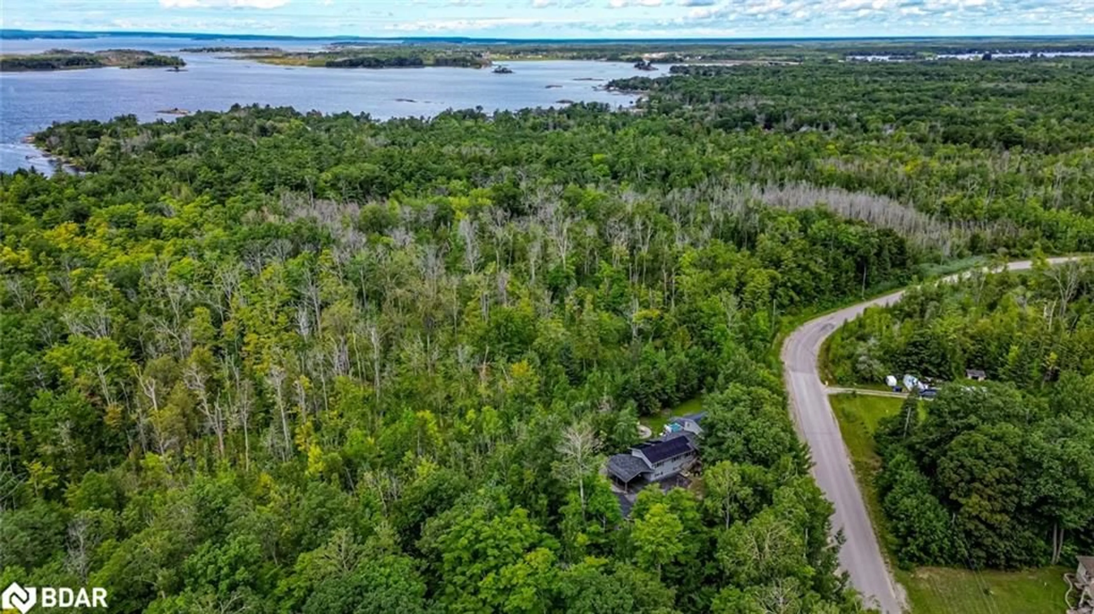 A pic from outside/outdoor area/front of a property/back of a property/a pic from drone, water/lake/river/ocean view for 36 Meadows Ave, Tay Ontario L0K 2C0