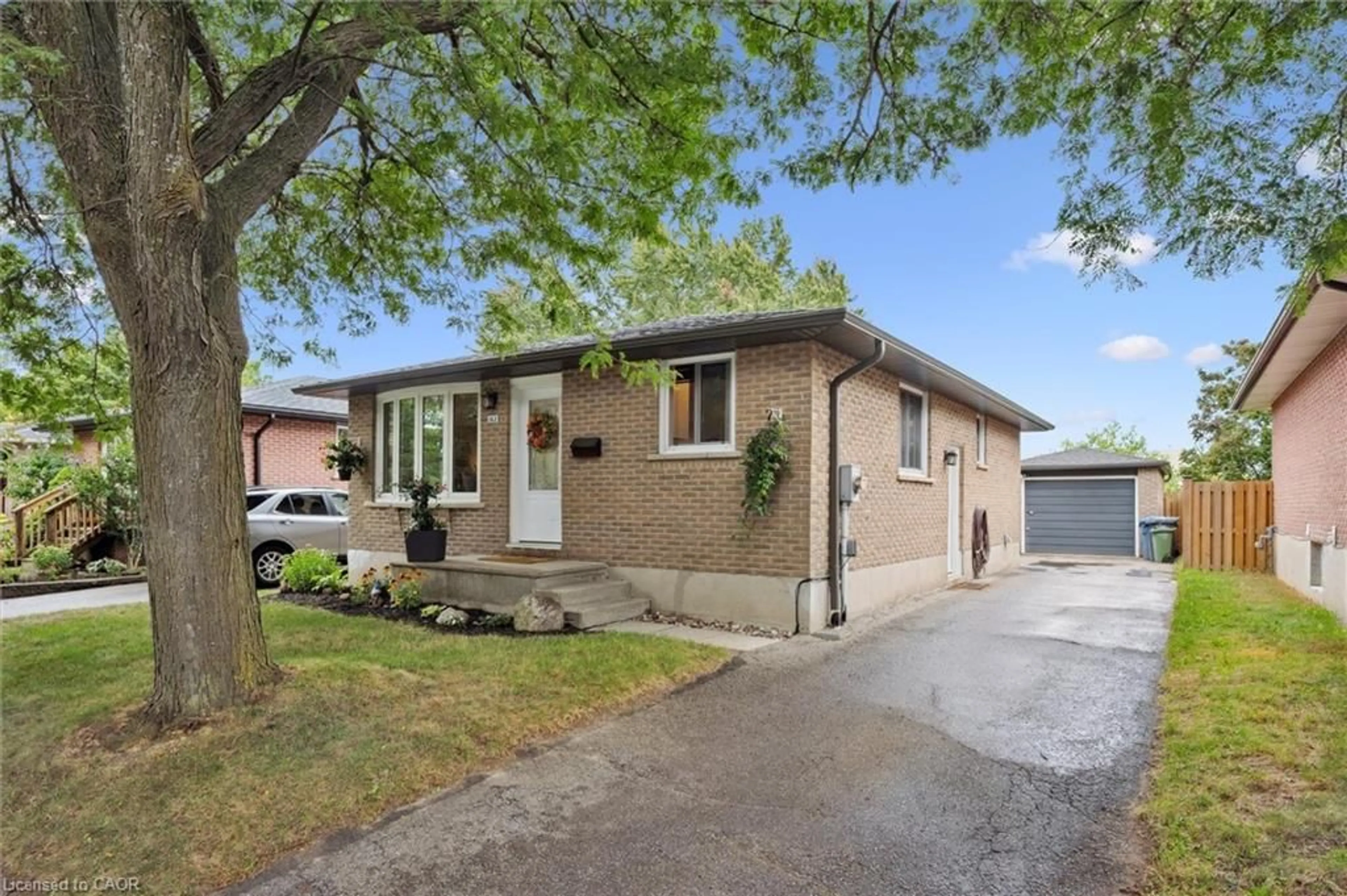 Home with brick exterior material, street for 163 Hadati Rd, Guelph Ontario N1E 6N3