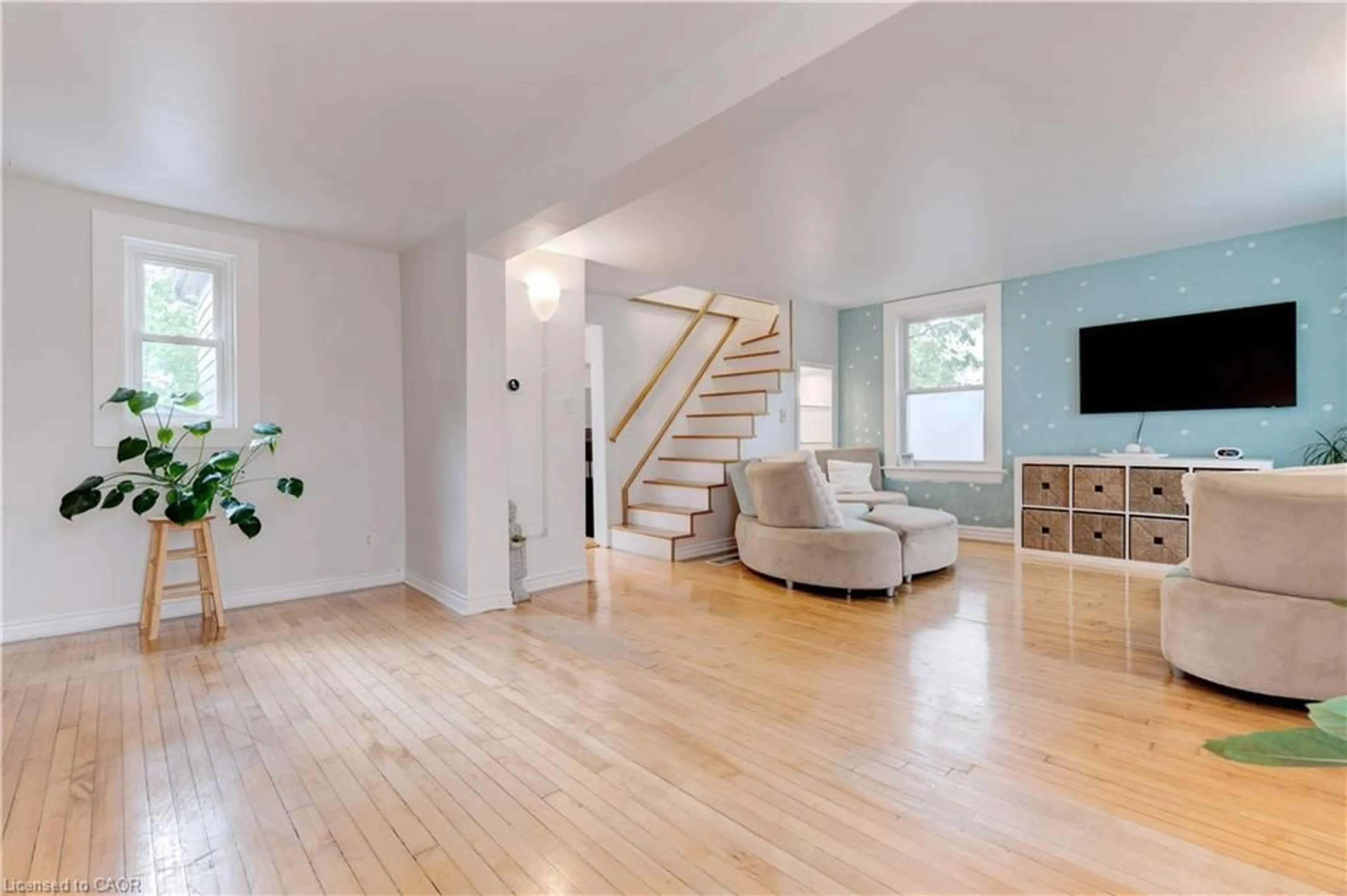 Living room with furniture, wood/laminate floor for 3038 Binbrook Rd, Hamilton Ontario L0R 1C0