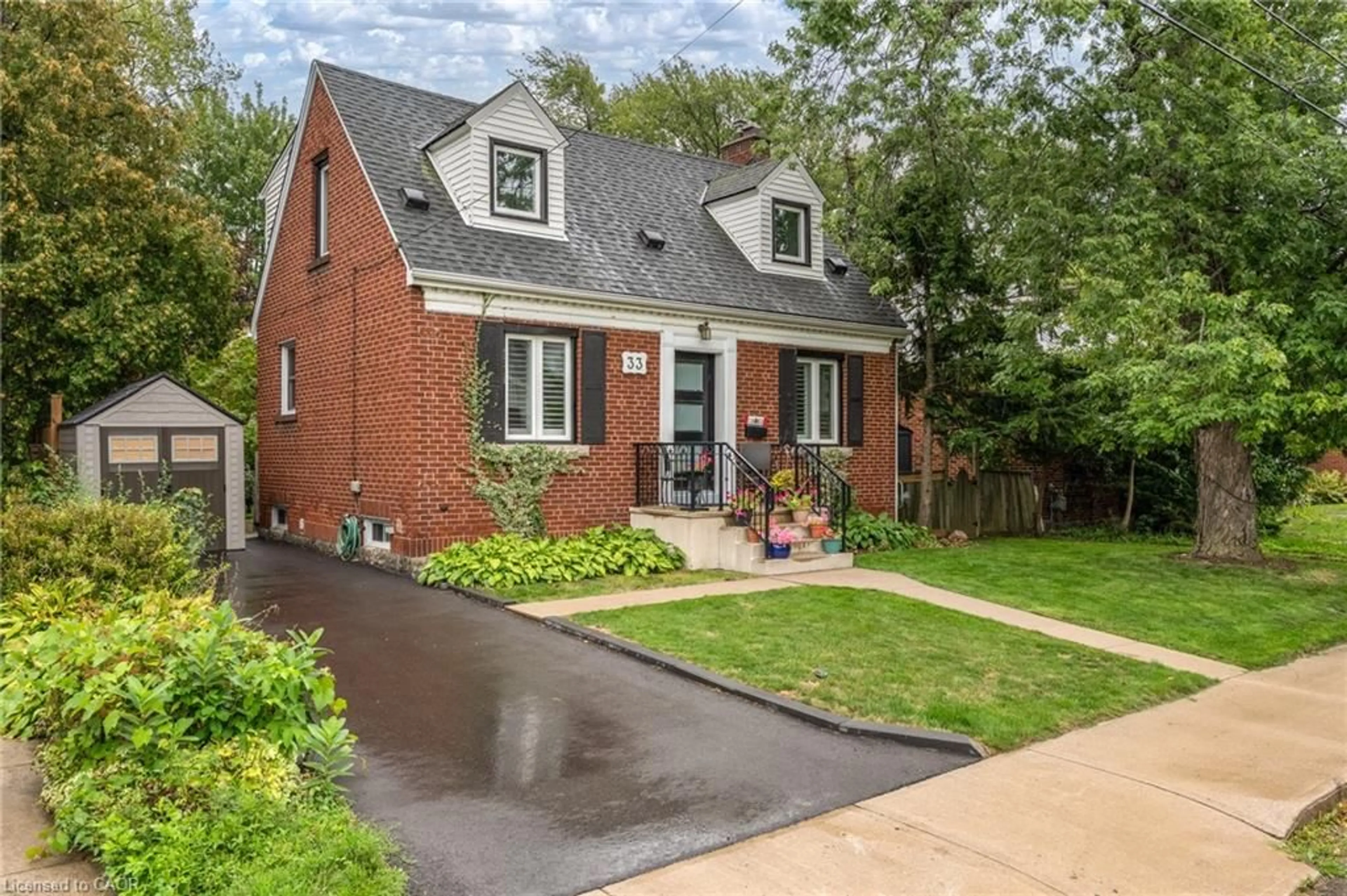 Home with brick exterior material, street for 33 East 12th St, Hamilton Ontario L9A 3X2