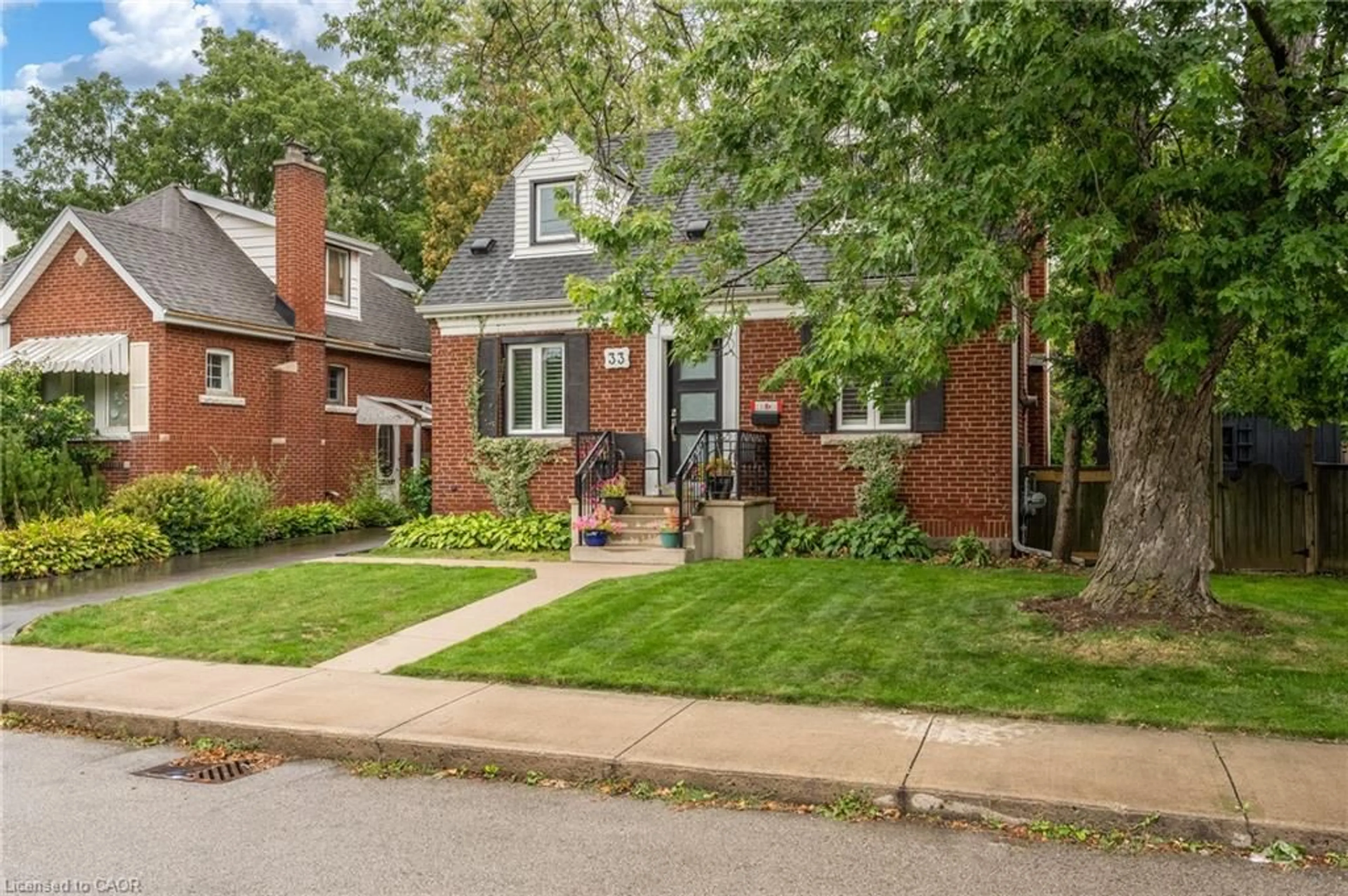Home with brick exterior material, street for 33 East 12th St, Hamilton Ontario L9A 3X2