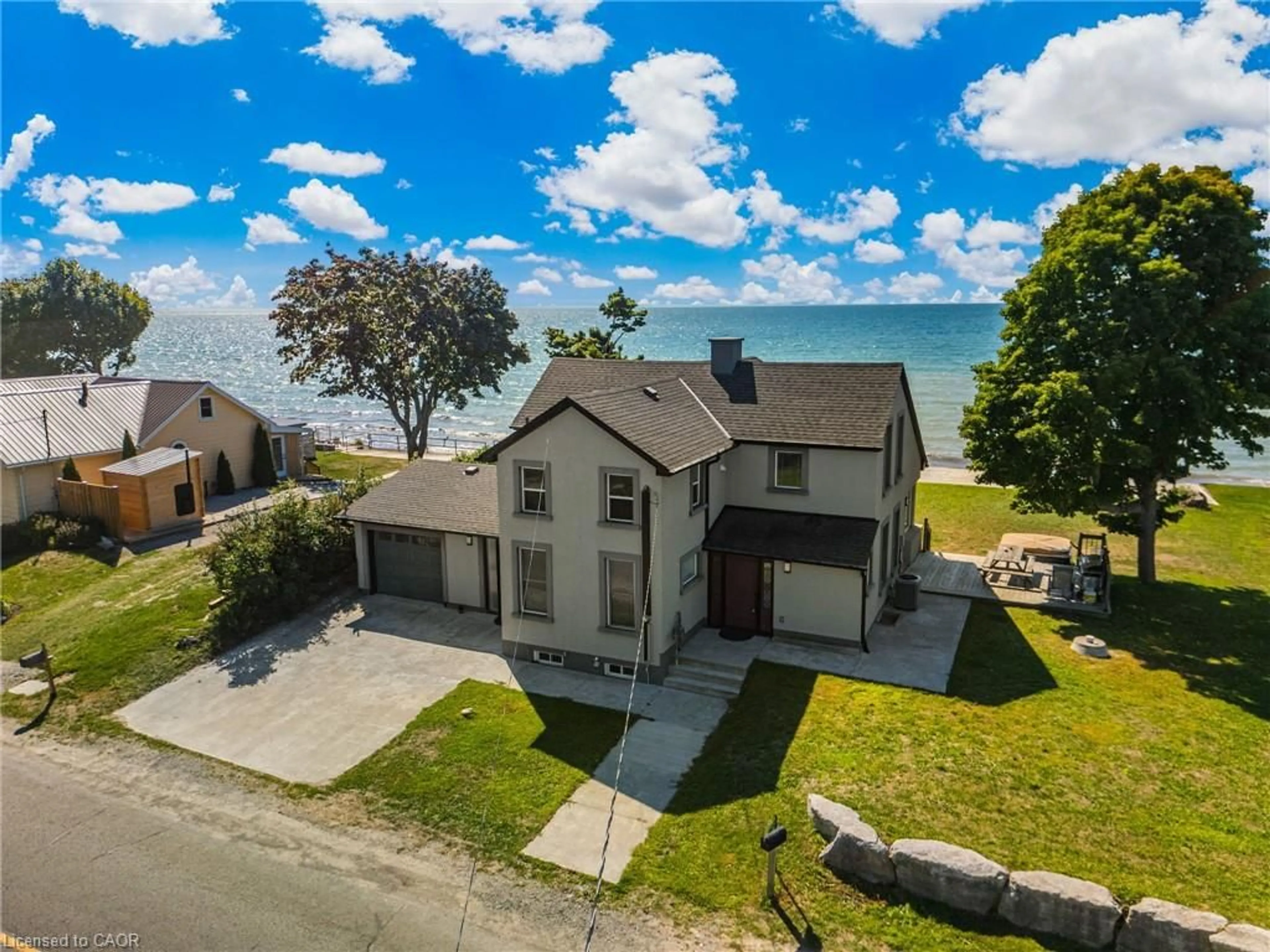 A pic from outside/outdoor area/front of a property/back of a property/a pic from drone, water/lake/river/ocean view for 2952 Northshore Dr, Lowbanks Ontario N0A 1K0