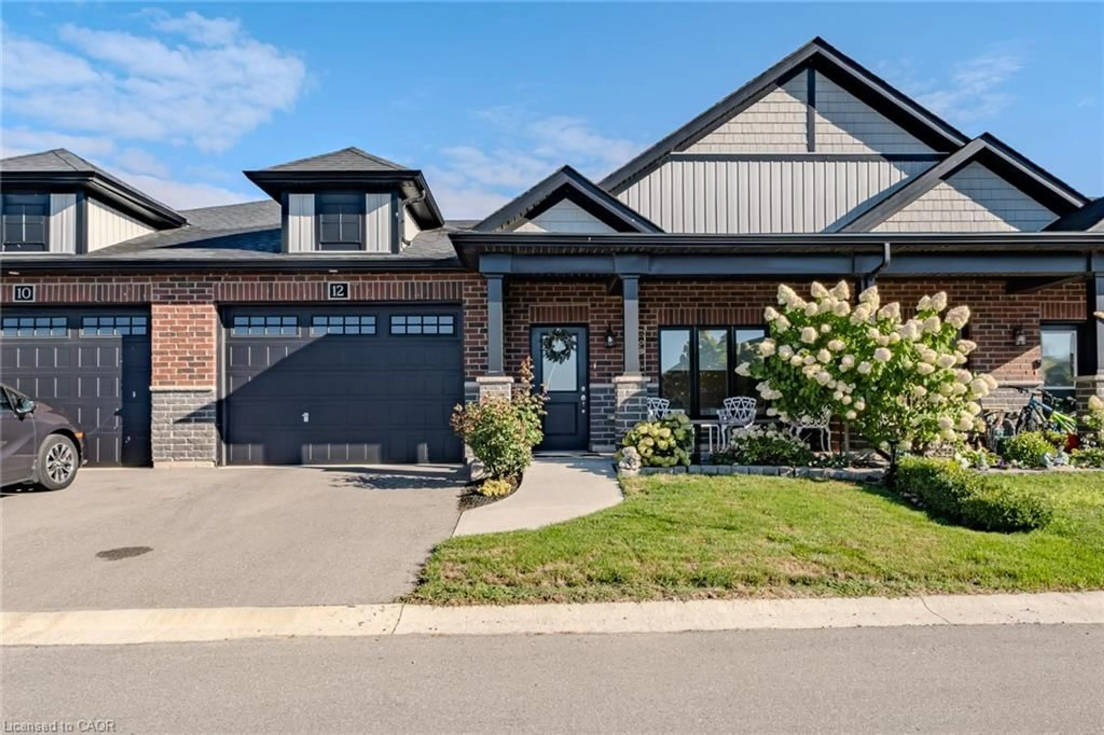 Home with brick exterior material, street for 12 Brookfield Lane, Simcoe Ontario N3Y 0E8