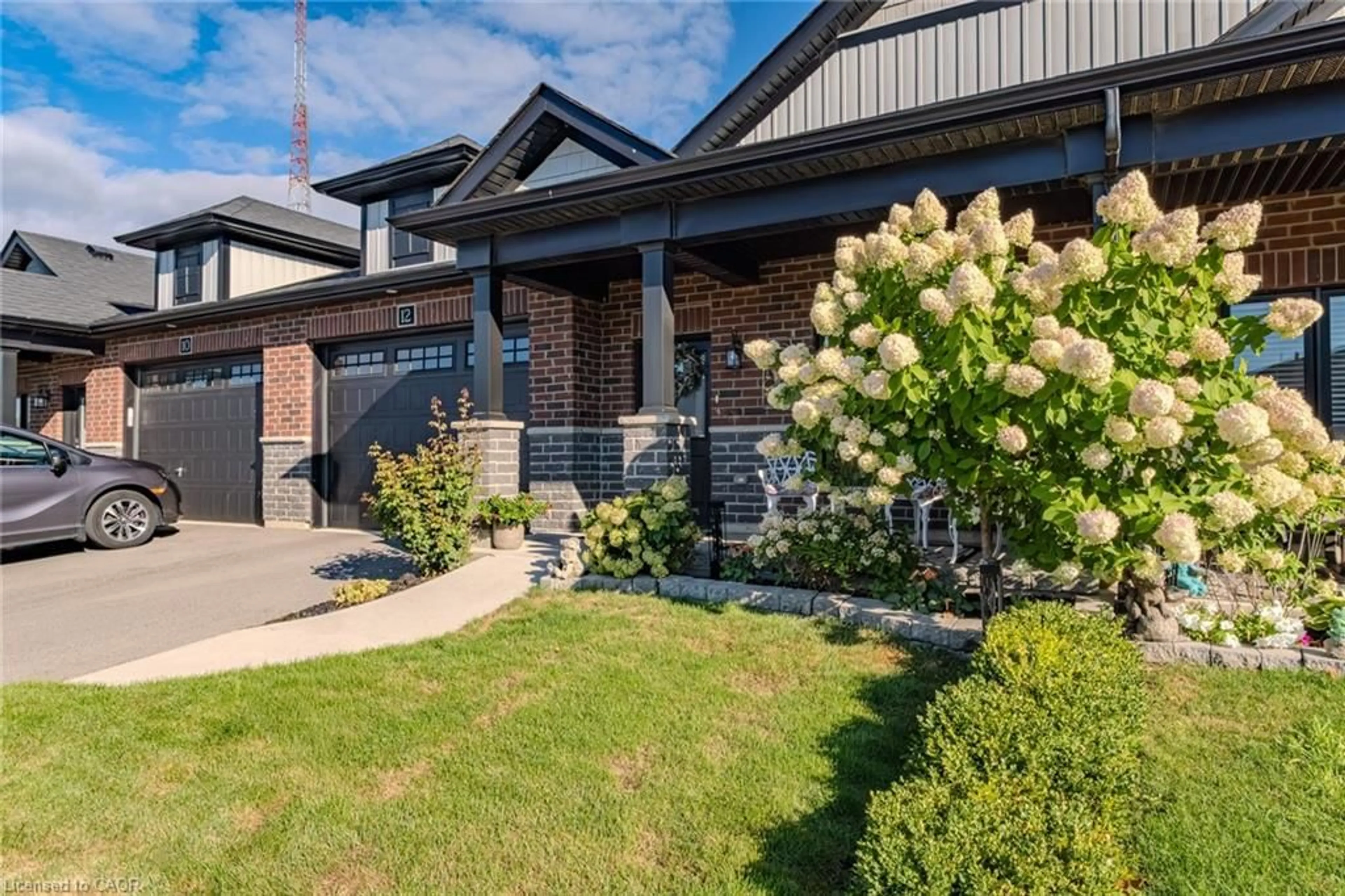 Home with brick exterior material, street for 12 Brookfield Lane, Simcoe Ontario N3Y 0E8