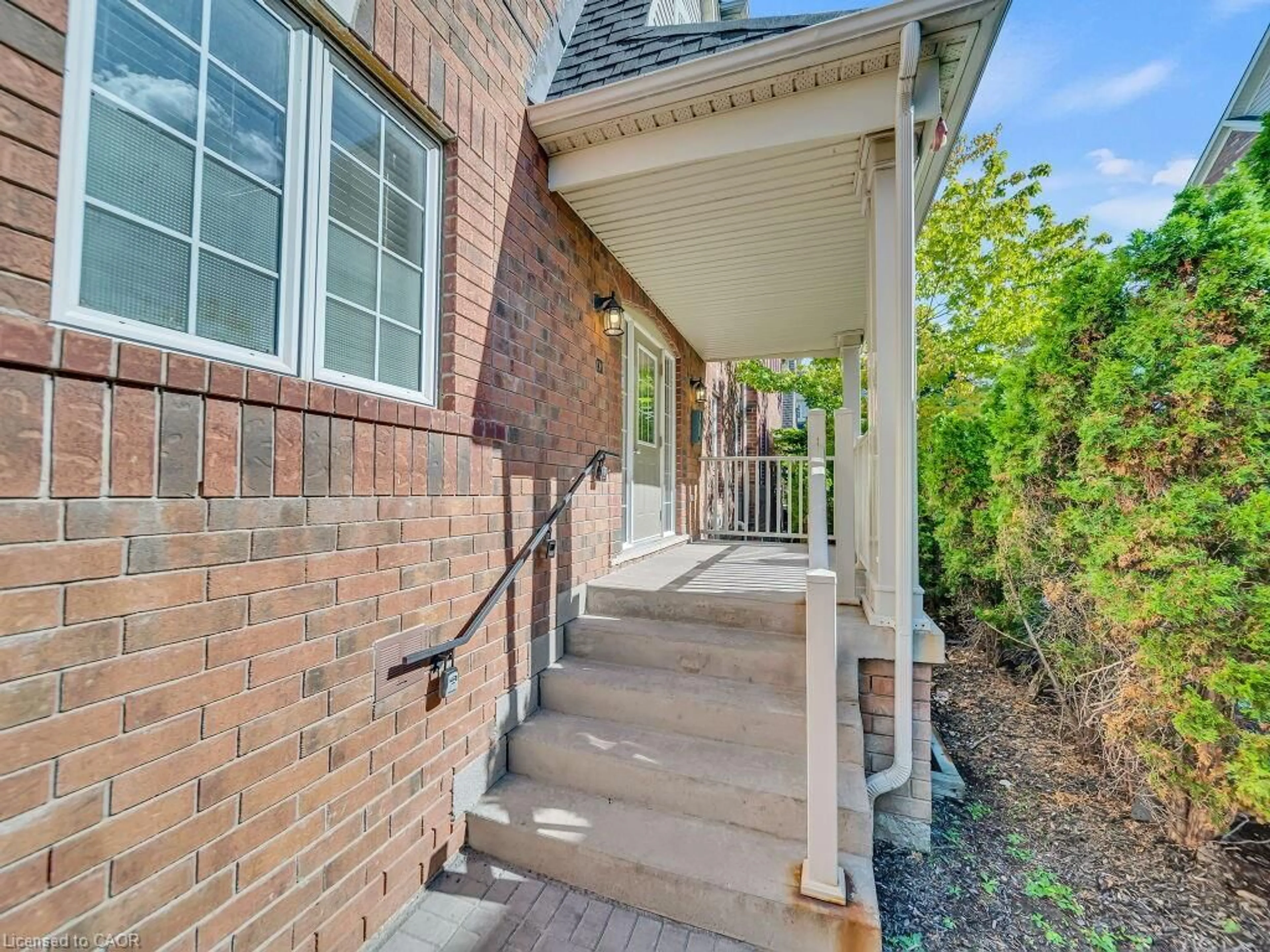 Home with brick exterior material, street for 700 Neighbourhood Cir #1, Mississauga Ontario L5B 0A6