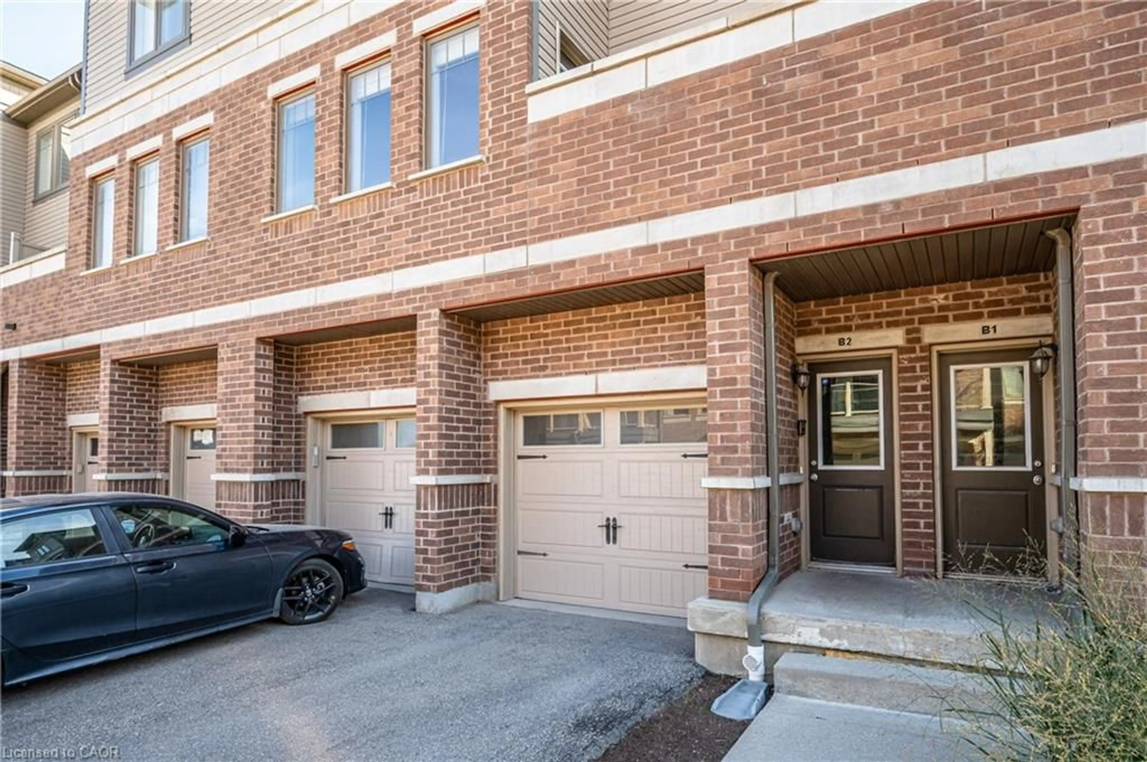Home with brick exterior material, street for 70 Willowrun Dr #B2, Kitchener Ontario N2A 0H5