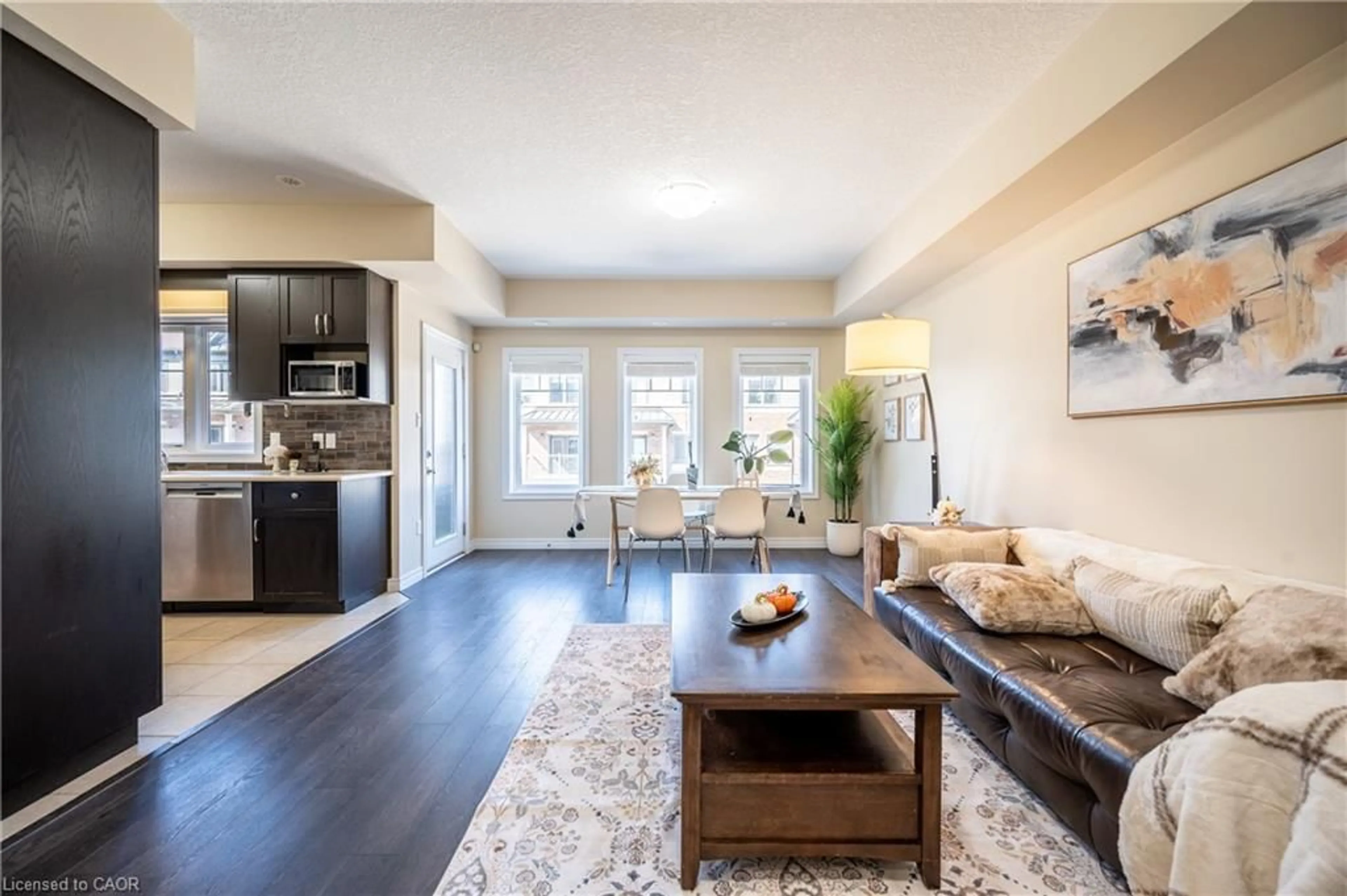 Living room with furniture, wood/laminate floor for 70 Willowrun Dr #B2, Kitchener Ontario N2A 0H5