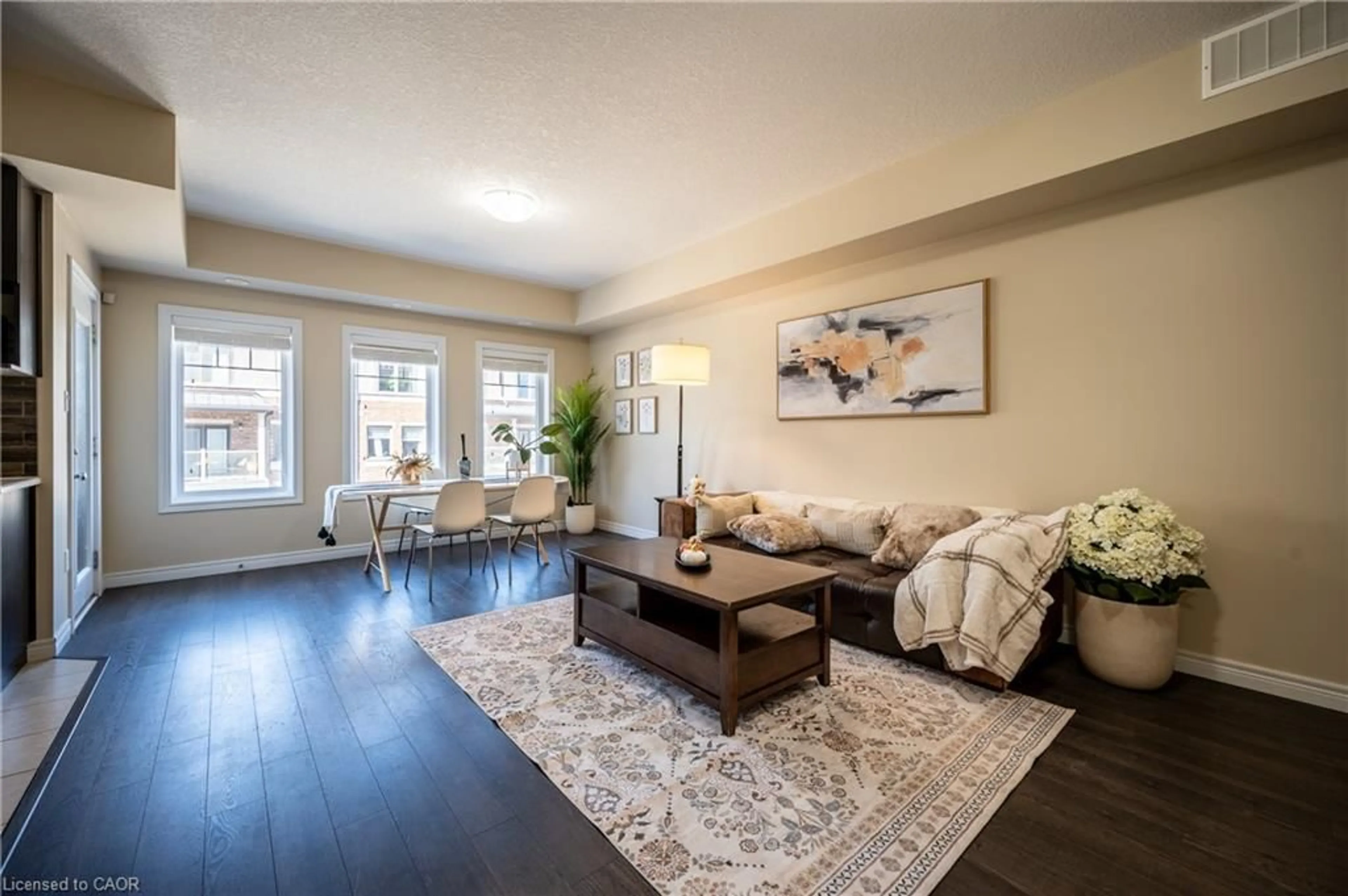 Living room with furniture, wood/laminate floor for 70 Willowrun Dr #B2, Kitchener Ontario N2A 0H5