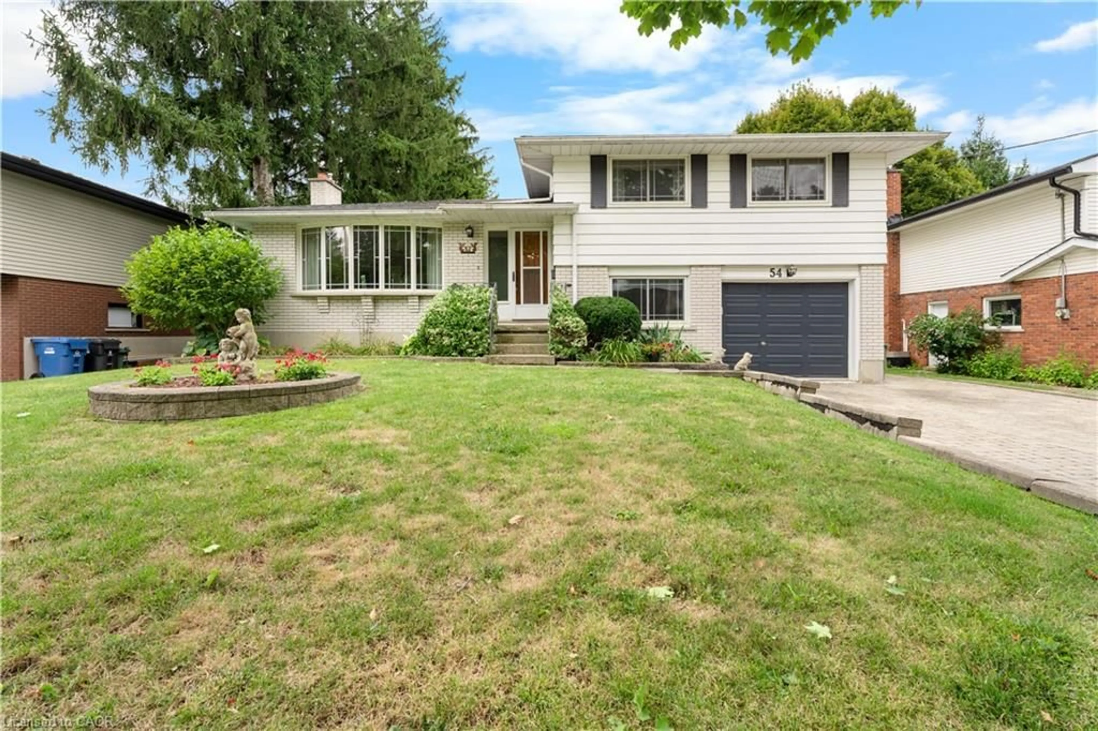 Home with vinyl exterior material, street for 54 Glenburnie Dr, Guelph Ontario N1E 4C6