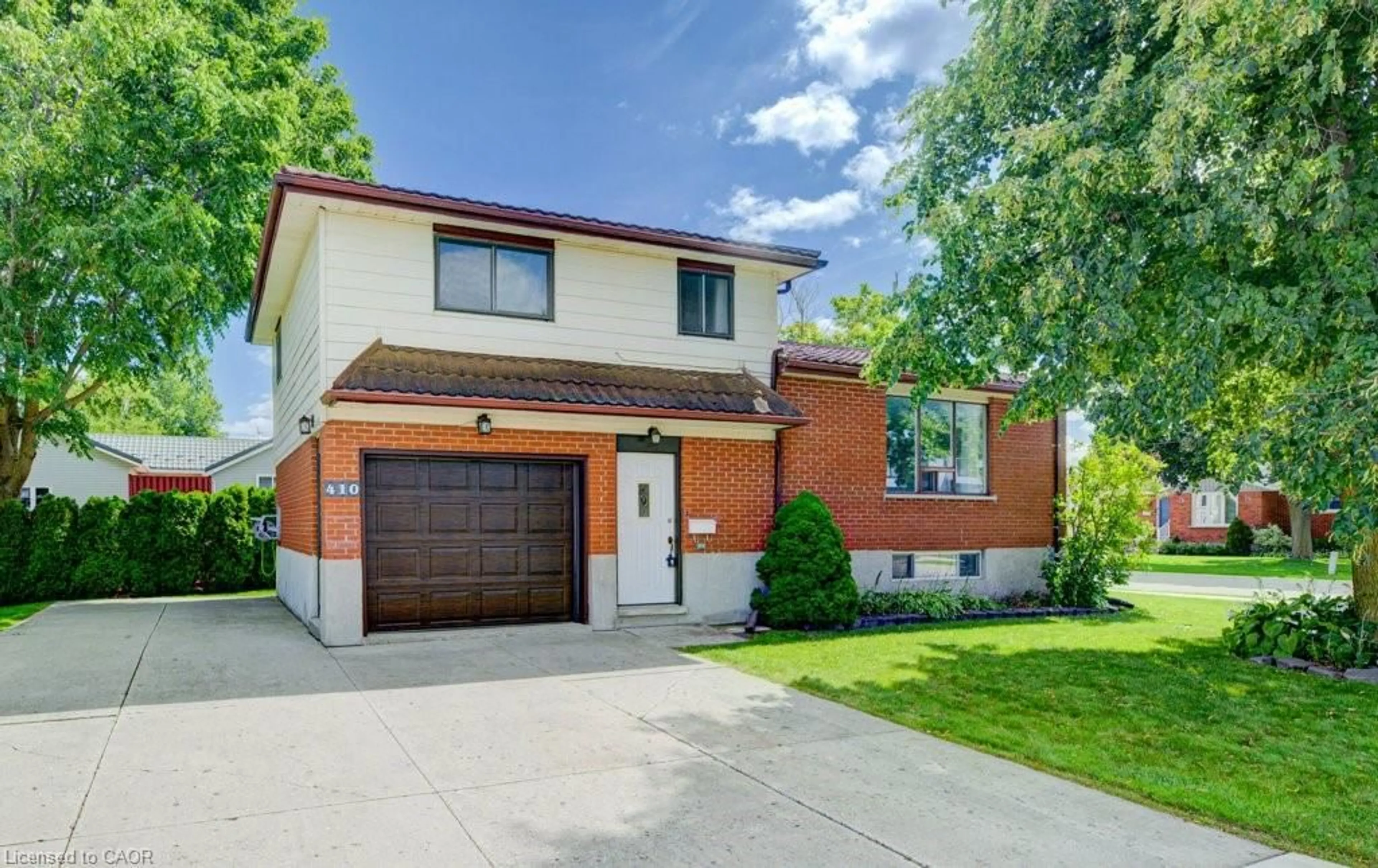 Home with brick exterior material, street for 410 Louise Ave, Listowel Ontario N4W 3P2