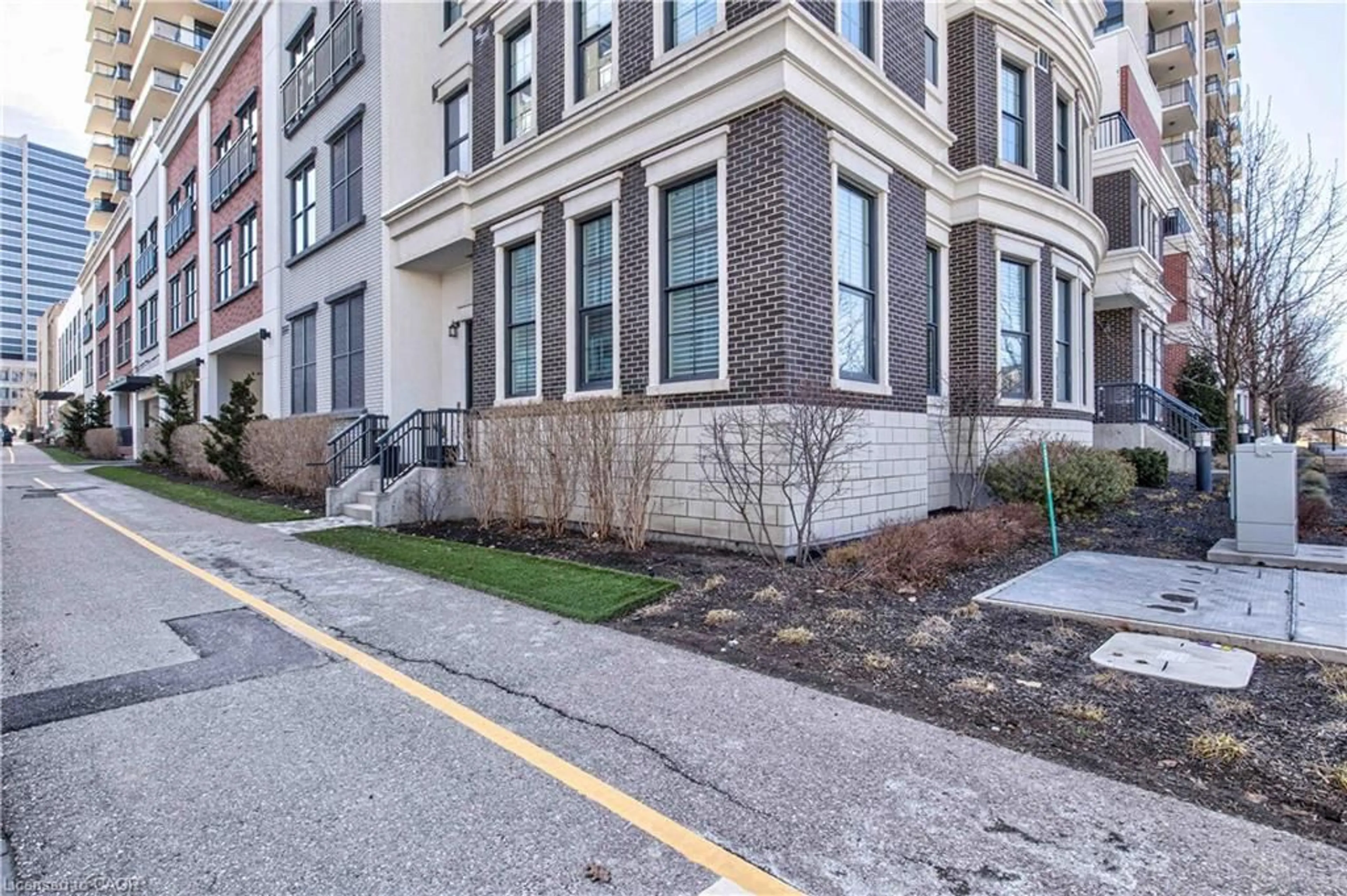 Home with brick exterior material, street for 155 Caroline St #TH10, Waterloo Ontario N2L 0J8