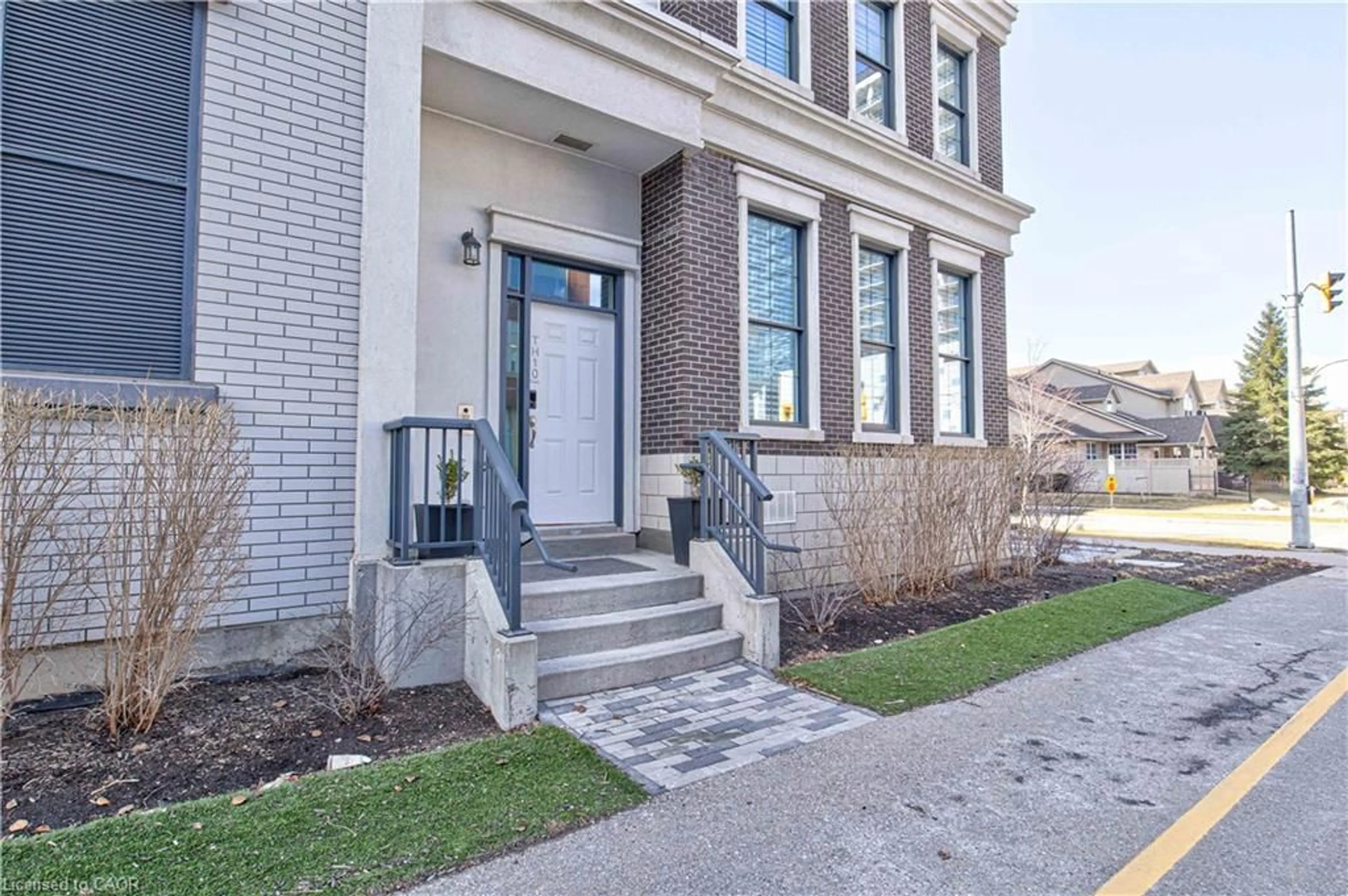 Home with brick exterior material, street for 155 Caroline St #TH10, Waterloo Ontario N2L 0J8
