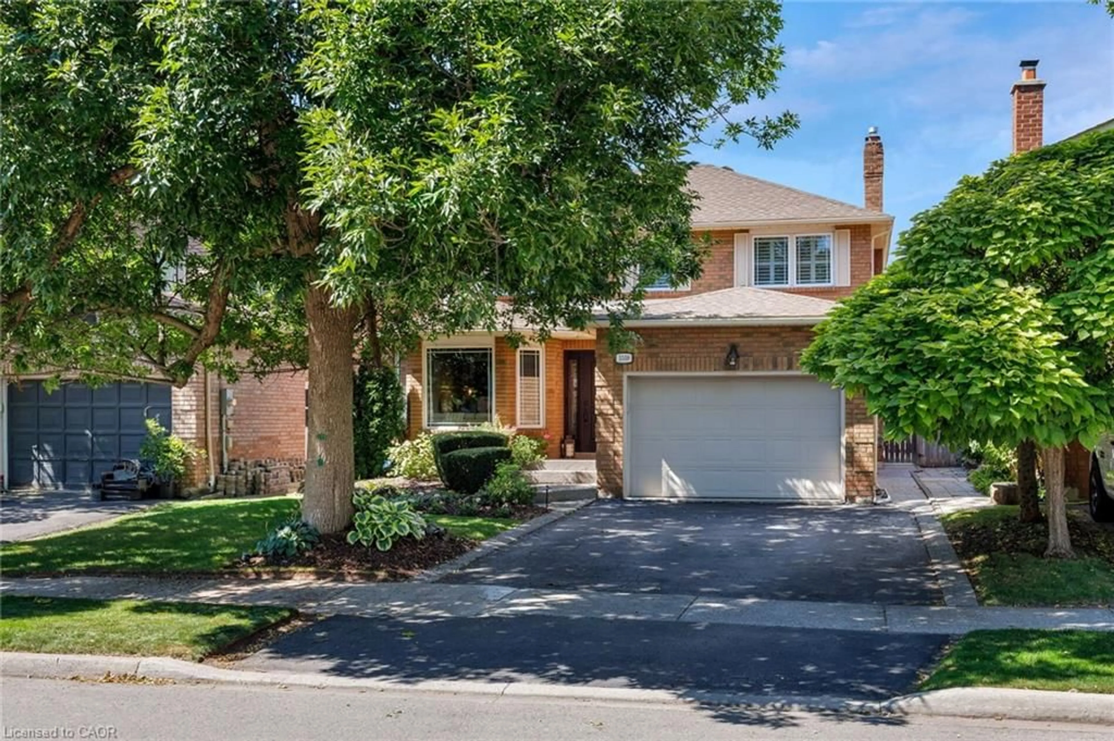 Home with brick exterior material, street for 1559 Stoneybrook Trail, Oakville Ontario L6M 2R4