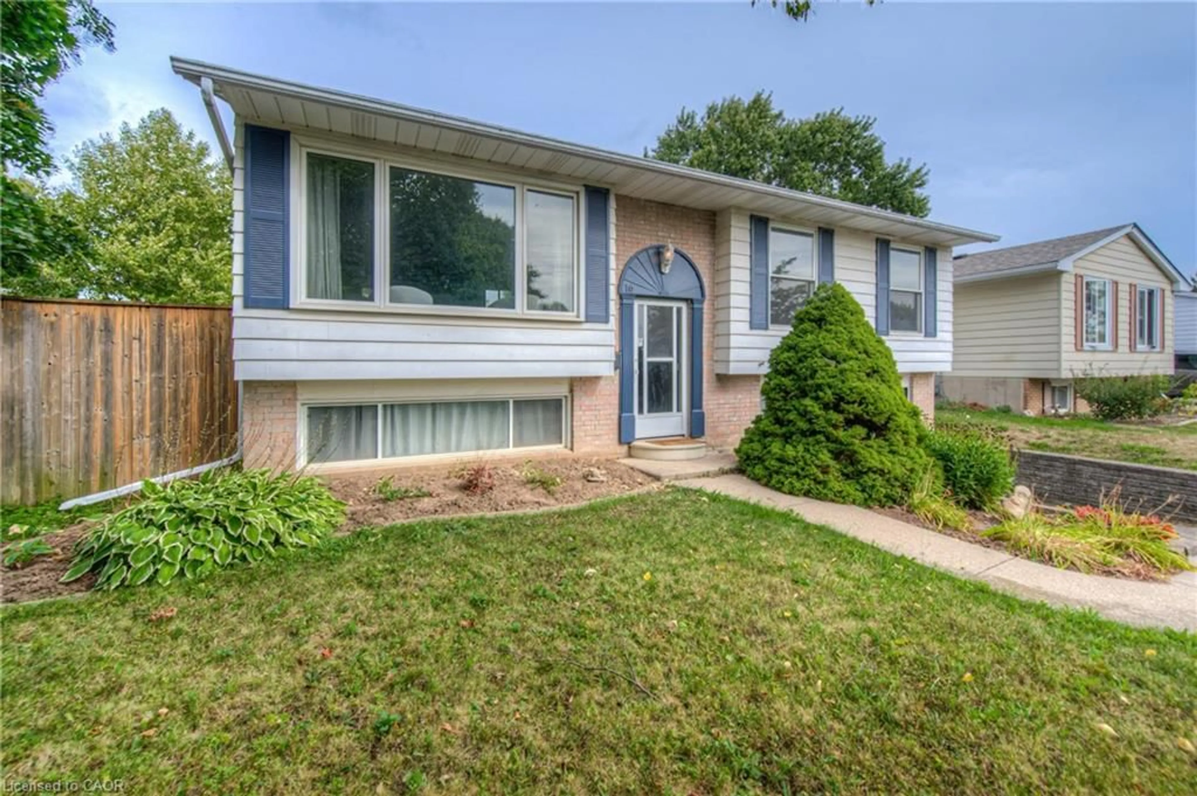 Home with vinyl exterior material, street for 16 Brisbane Blvd, Brantford Ontario N3S 4L2