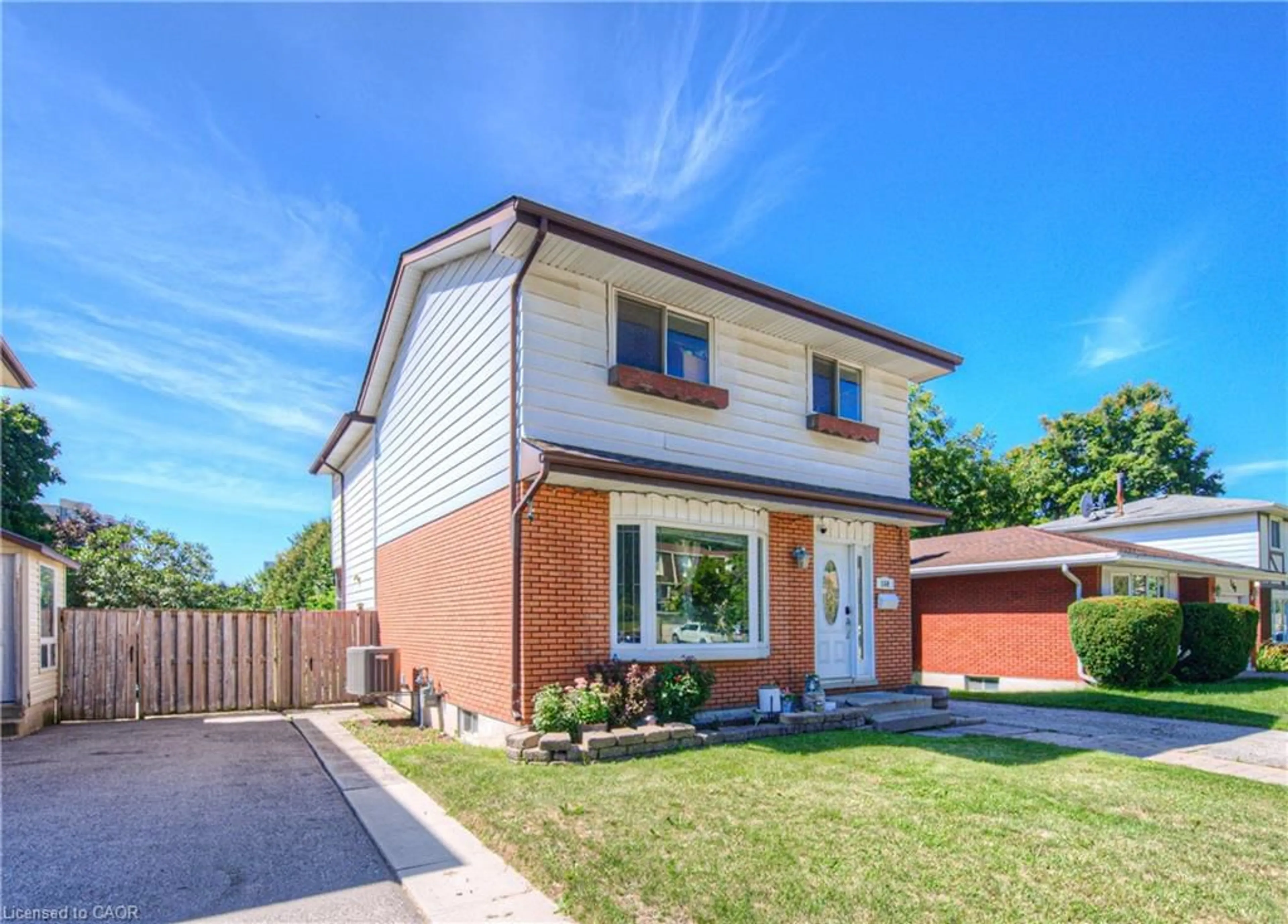Home with brick exterior material, street for 164 Green Valley Dr, Kitchener Ontario N2P 1C4