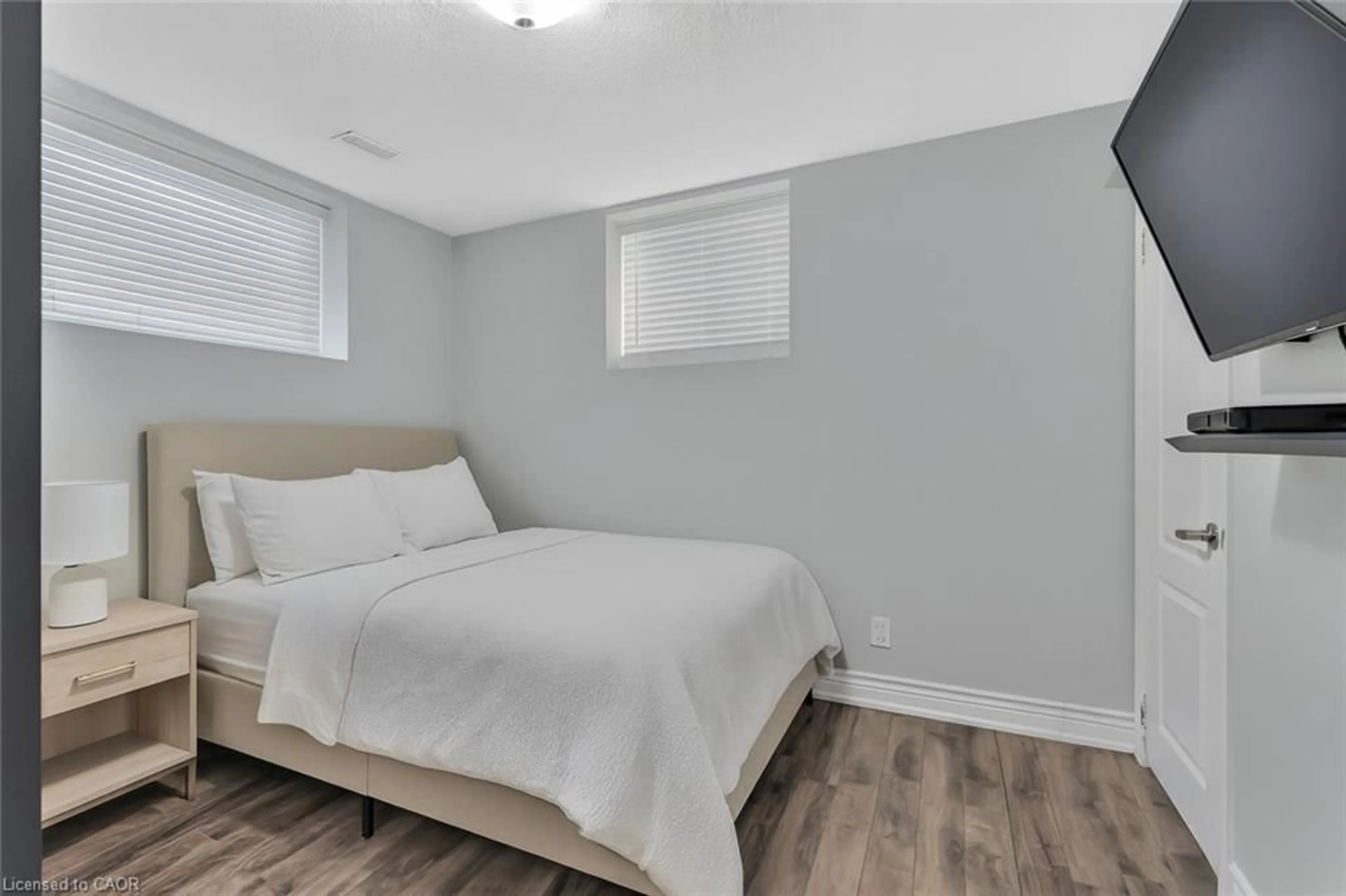 Bedroom with bed, wood/laminate floor for 318 East 43rd St, Hamilton Ontario L8T 3C7