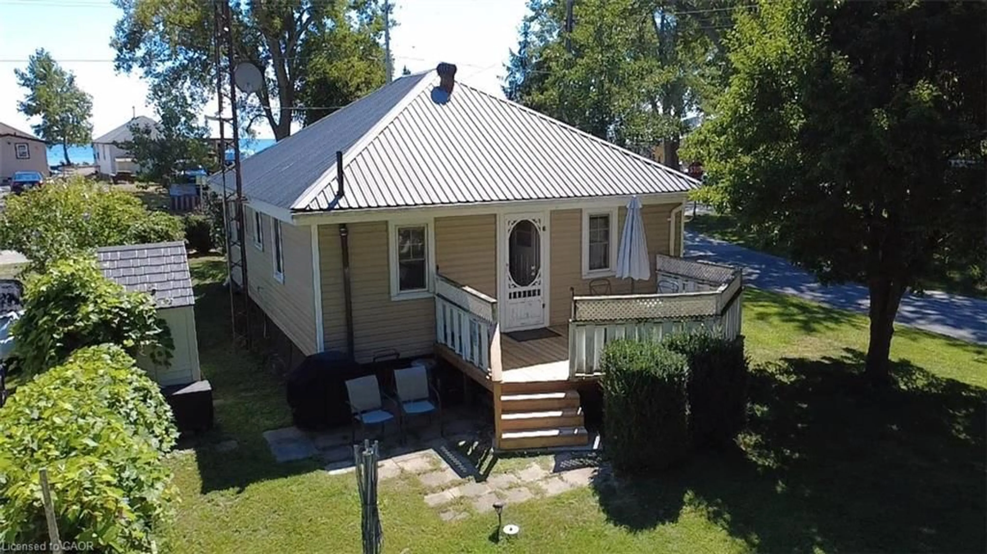 A pic from outside/outdoor area/front of a property/back of a property/a pic from drone, street for 88 Erie Blvd, Long Point Ontario N0E 1M0