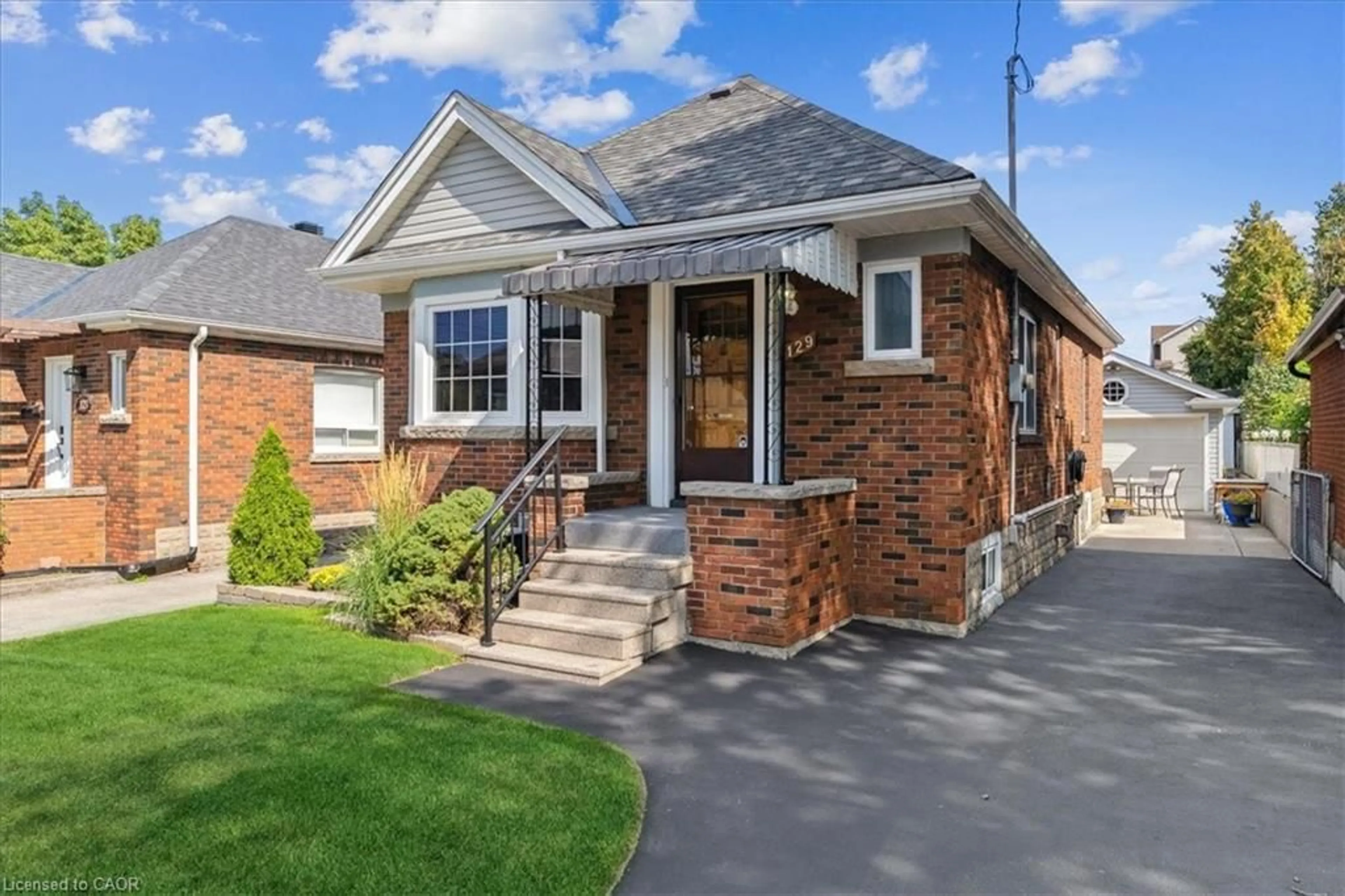 Home with brick exterior material, street for 129 Barons Ave, Hamilton Ontario L8K 2Y8