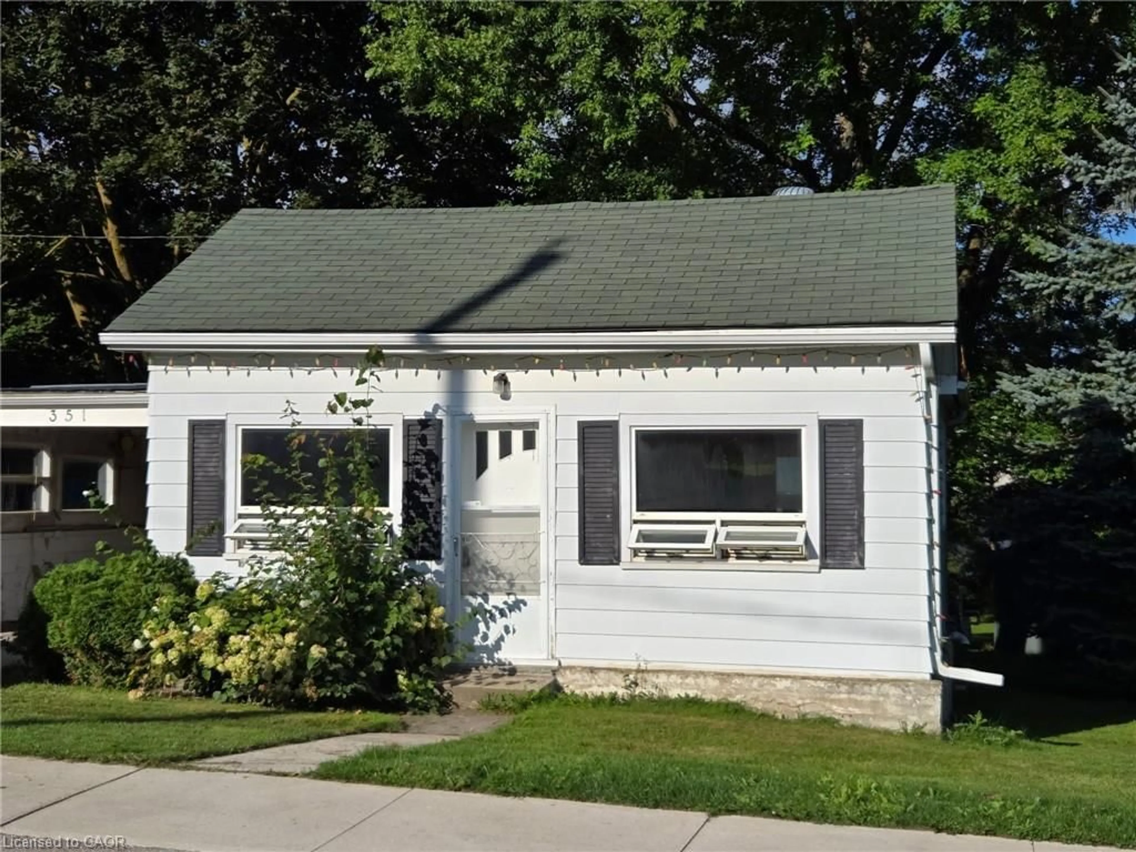 Home with vinyl exterior material, street for 351 William St, Mount Forest Ontario N0G 2L3