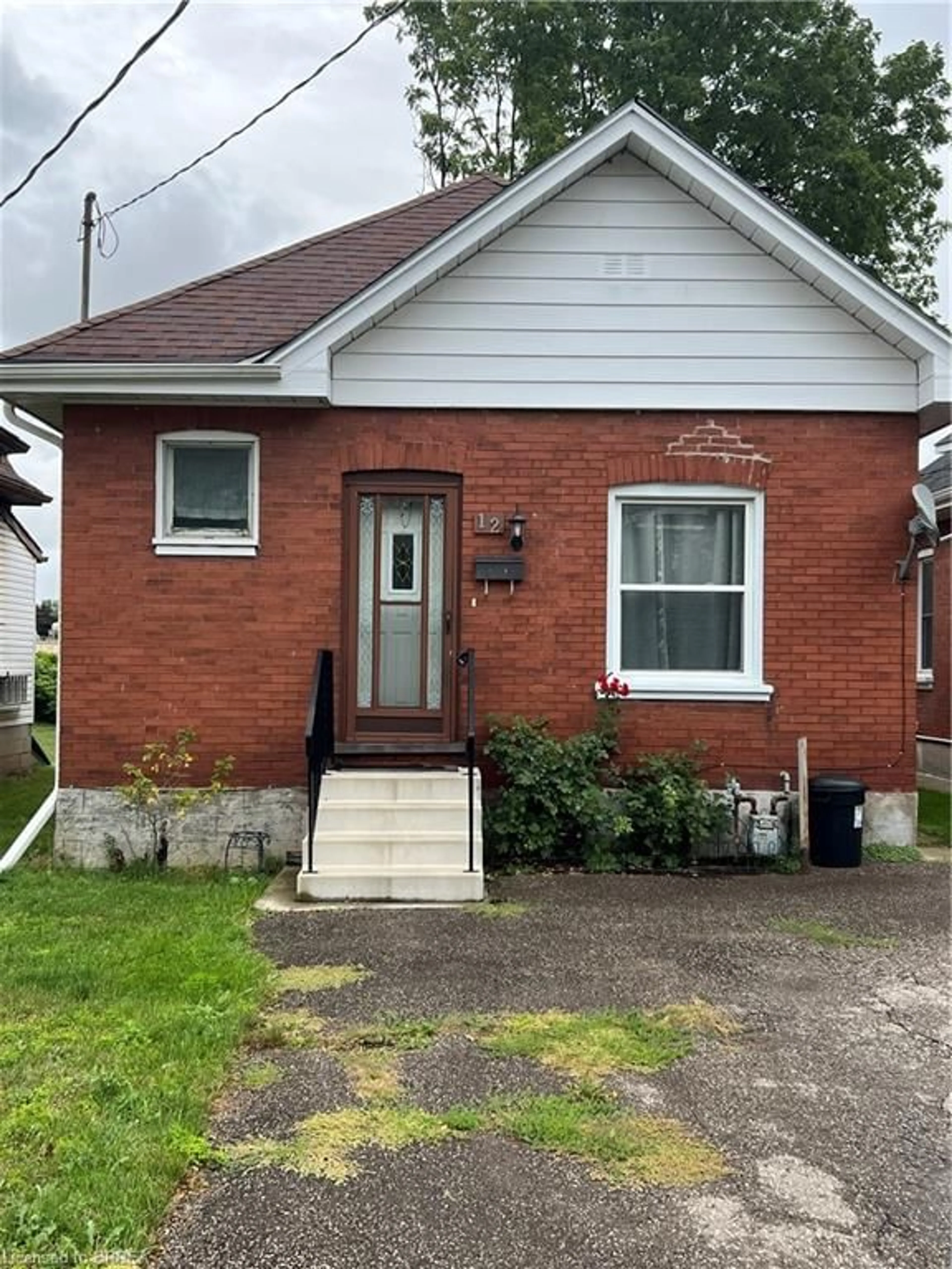 Home with brick exterior material, street for 12 Carlyle St, Brantford Ontario N3T 2C1