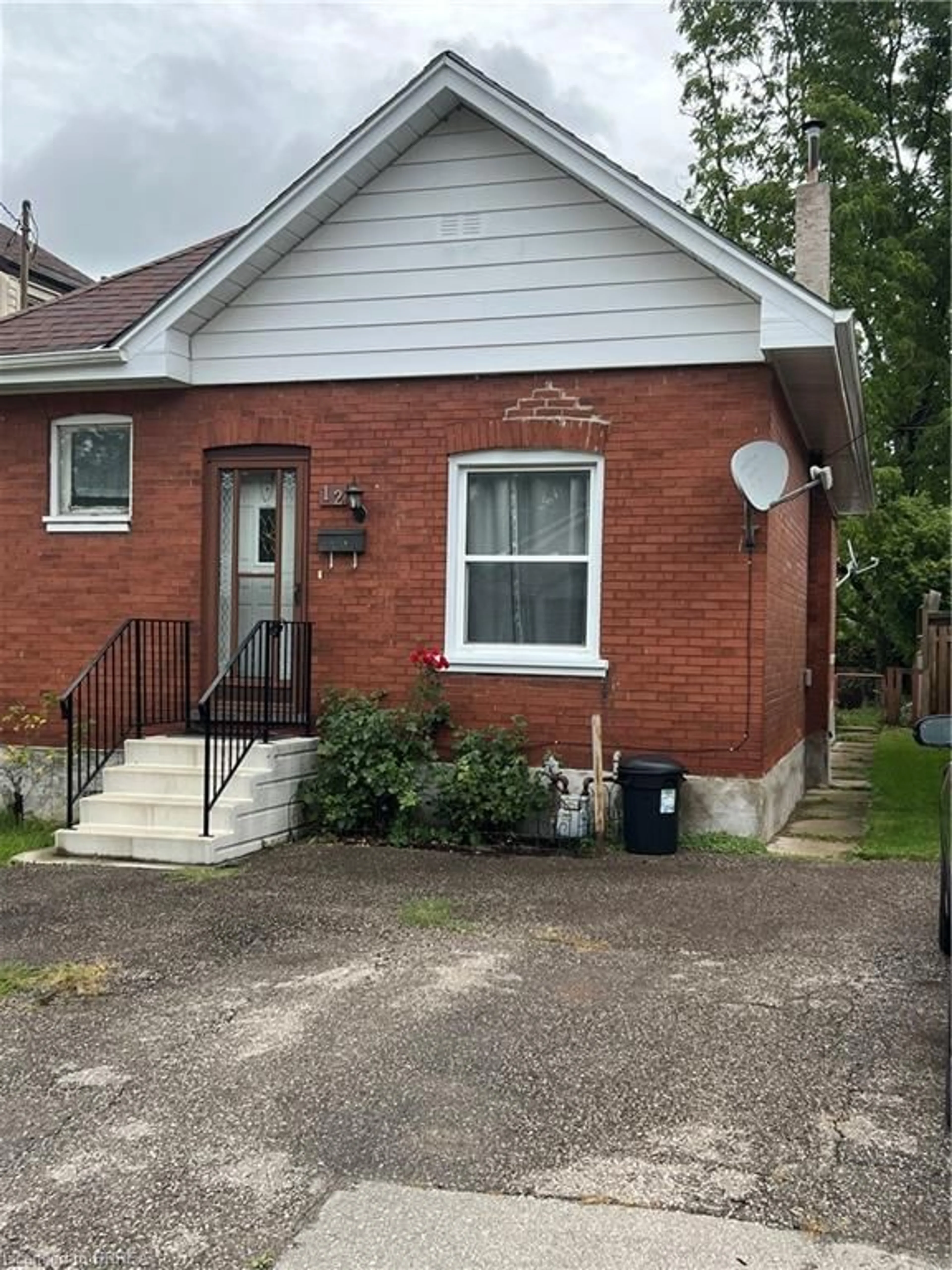 Home with brick exterior material, street for 12 Carlyle St, Brantford Ontario N3T 2C1