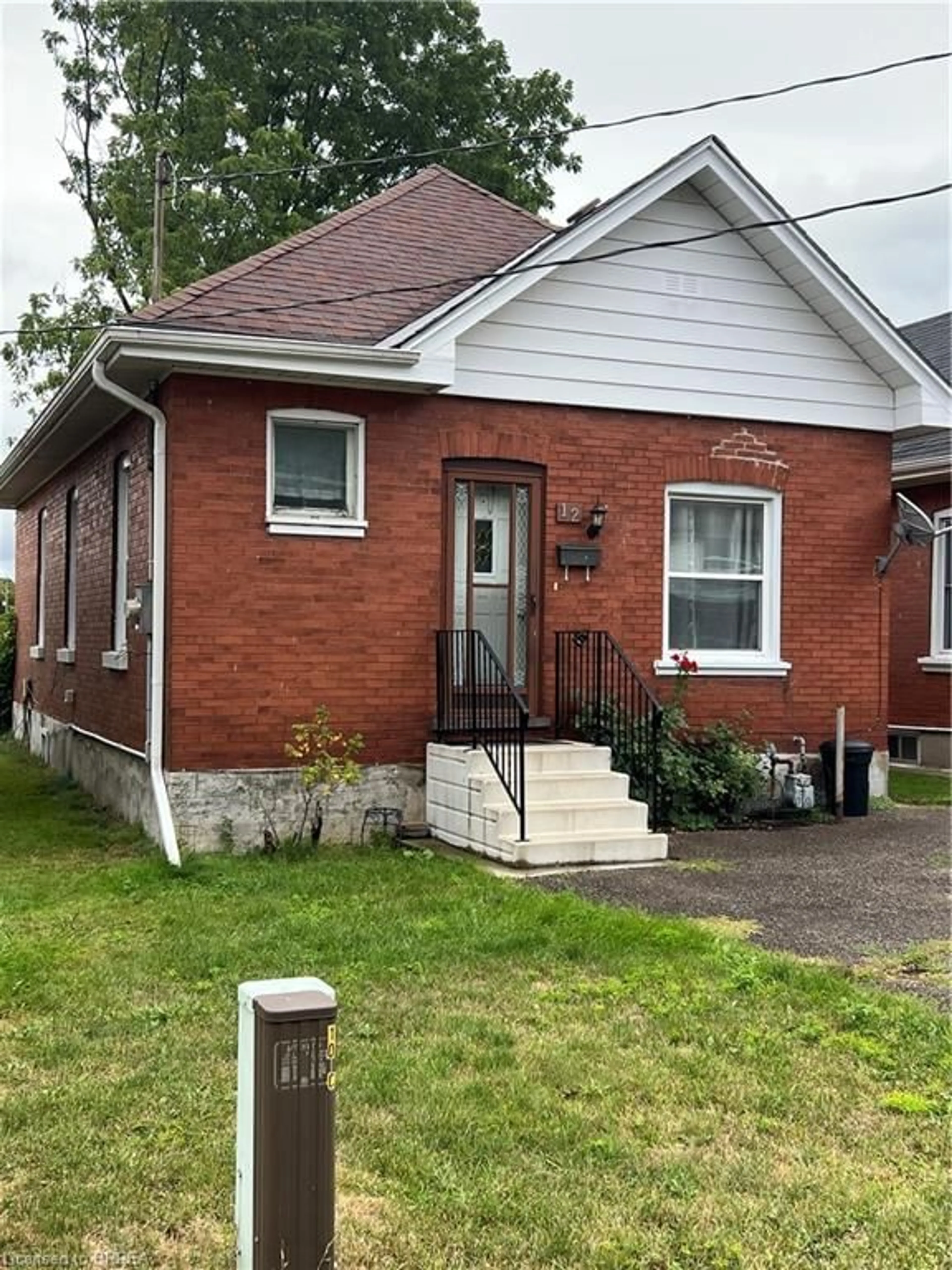 Home with brick exterior material, street for 12 Carlyle St, Brantford Ontario N3T 2C1