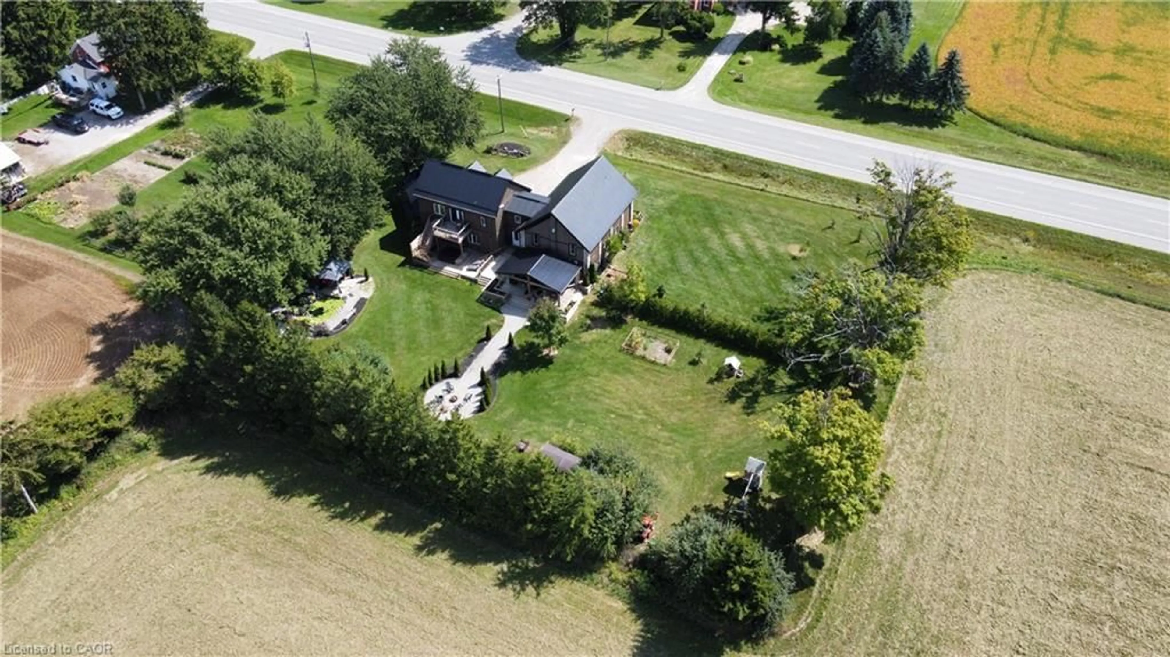 A pic from outside/outdoor area/front of a property/back of a property/a pic from drone, street for 5098 Perth Road 164, Rr 5, Bornholm Ontario N0K 1N0