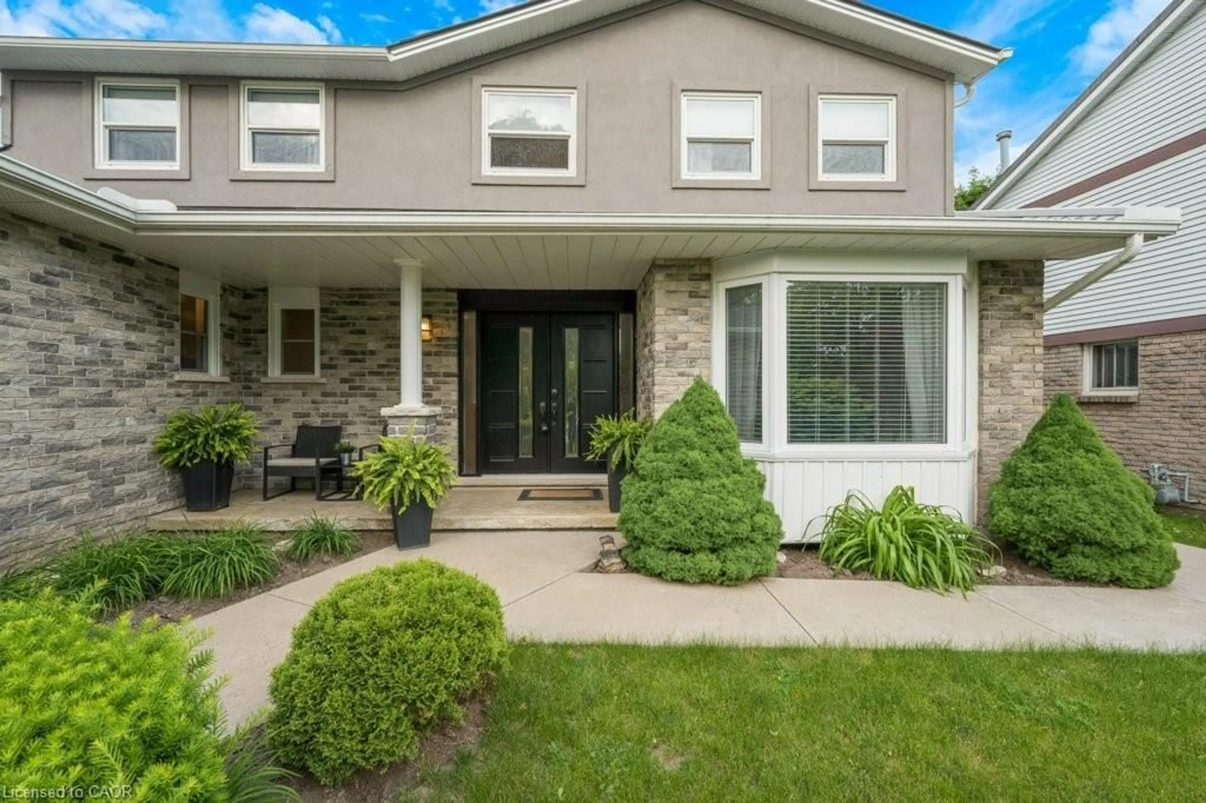 Home with vinyl exterior material, street for 14 Pathfinder Cres, Kitchener Ontario N2P 1S6