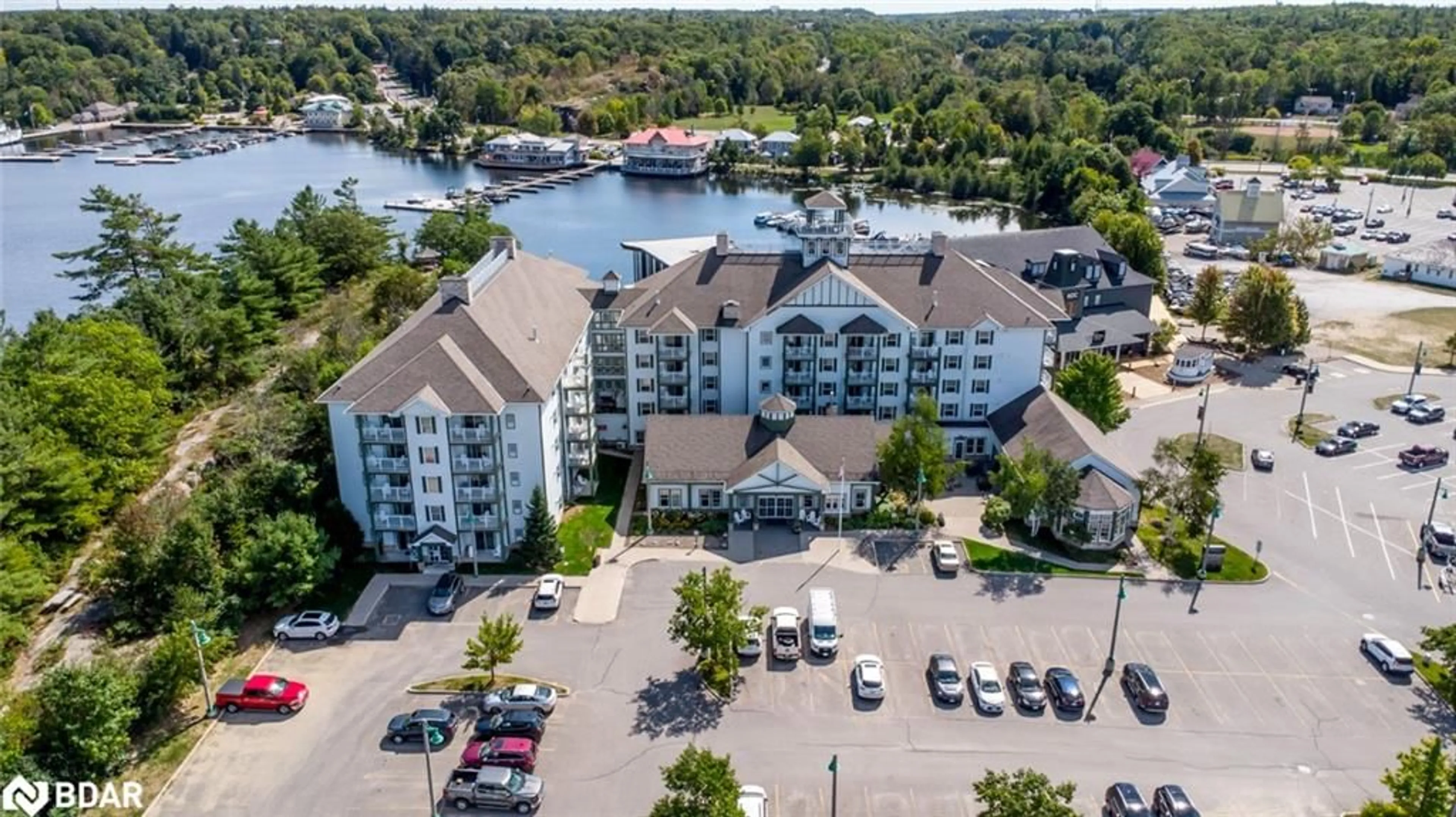 A pic from outside/outdoor area/front of a property/back of a property/a pic from drone, water/lake/river/ocean view for 285 Steamship Bay Road #410, Gravenhurst Ontario P1P 1Z9