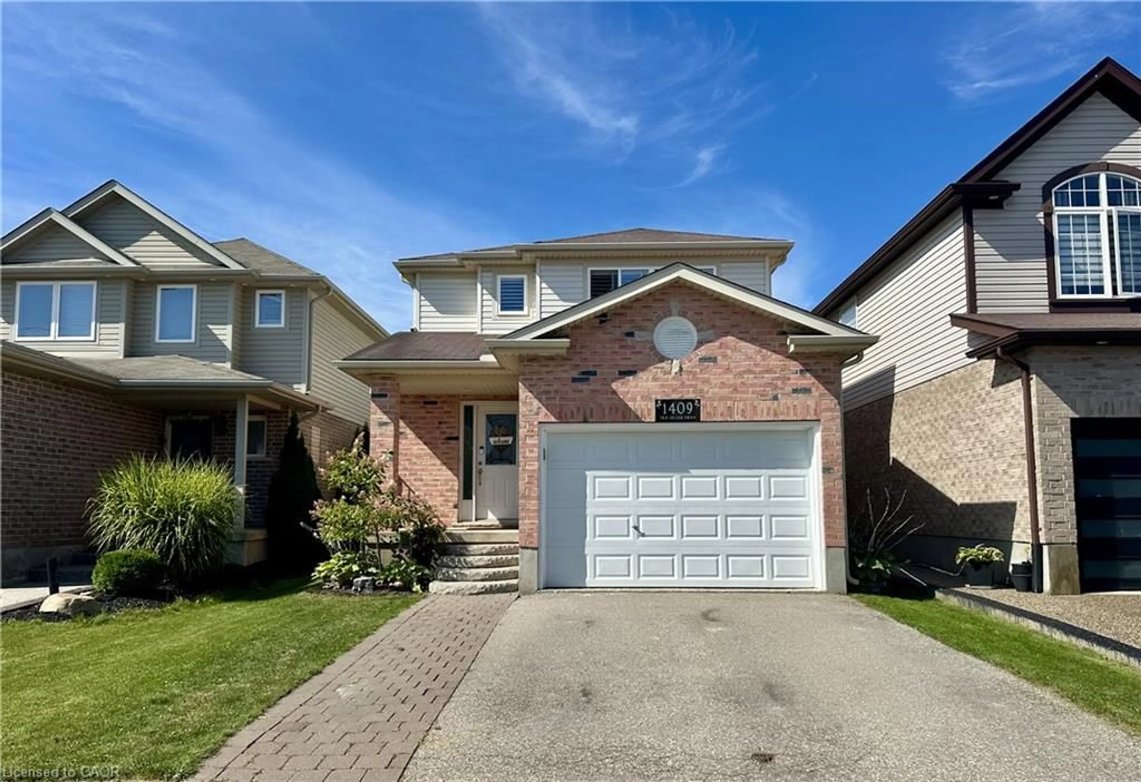 Home with brick exterior material, street for 1409 Old Zeller Dr, Kitchener Ontario N2A 4M8