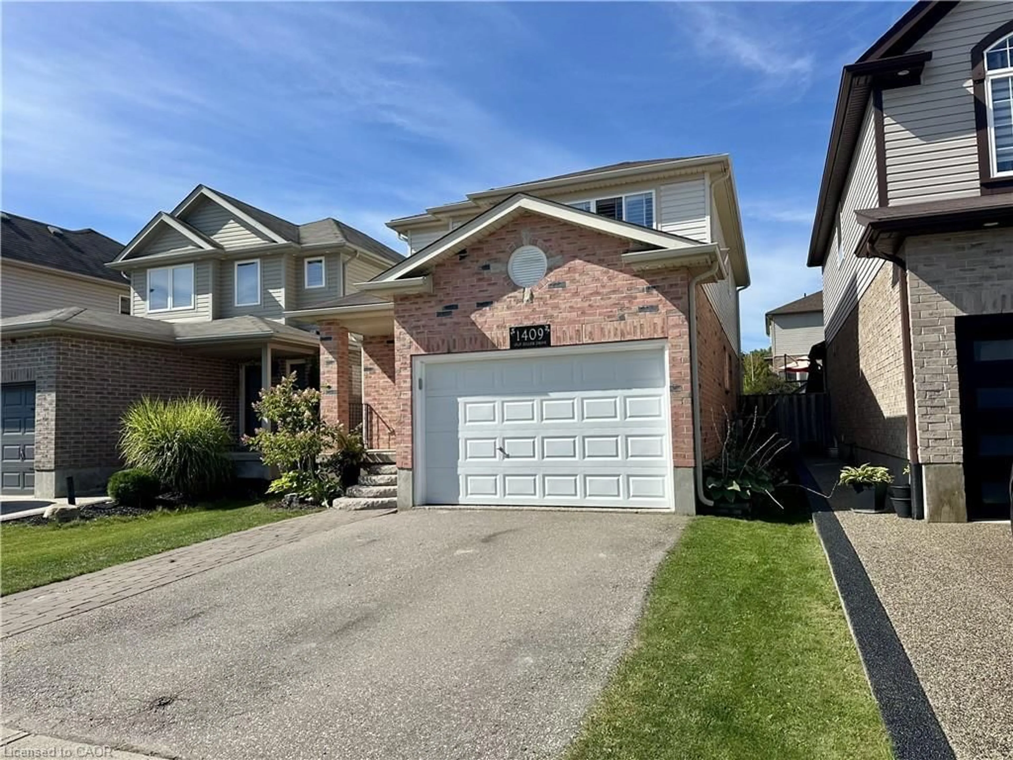 Home with brick exterior material, street for 1409 Old Zeller Dr, Kitchener Ontario N2A 4M8