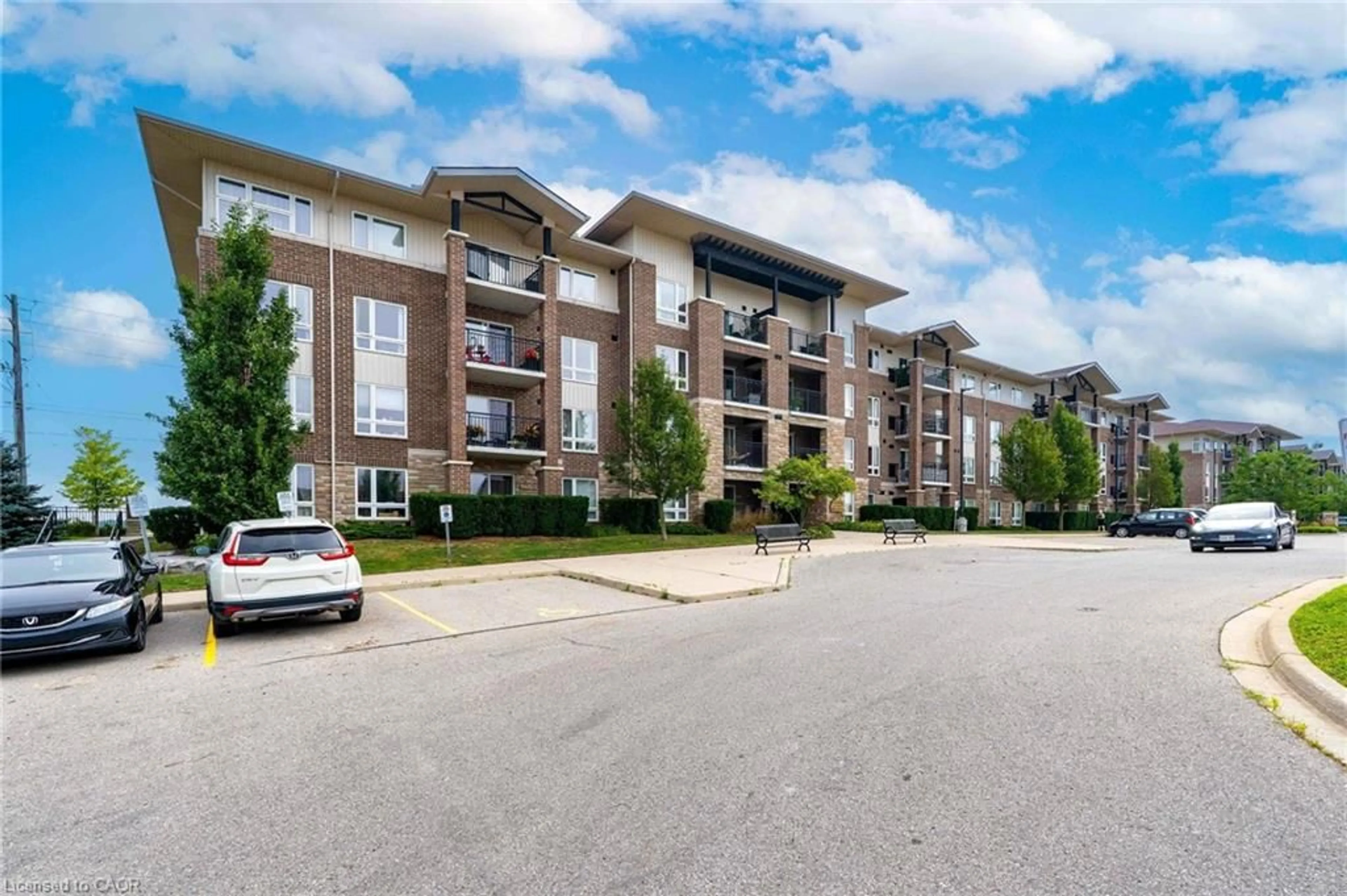 A pic from outside/outdoor area/front of a property/back of a property/a pic from drone, unknown for 67 Kingsbury Sq #307, Guelph Ontario N1L 0L3