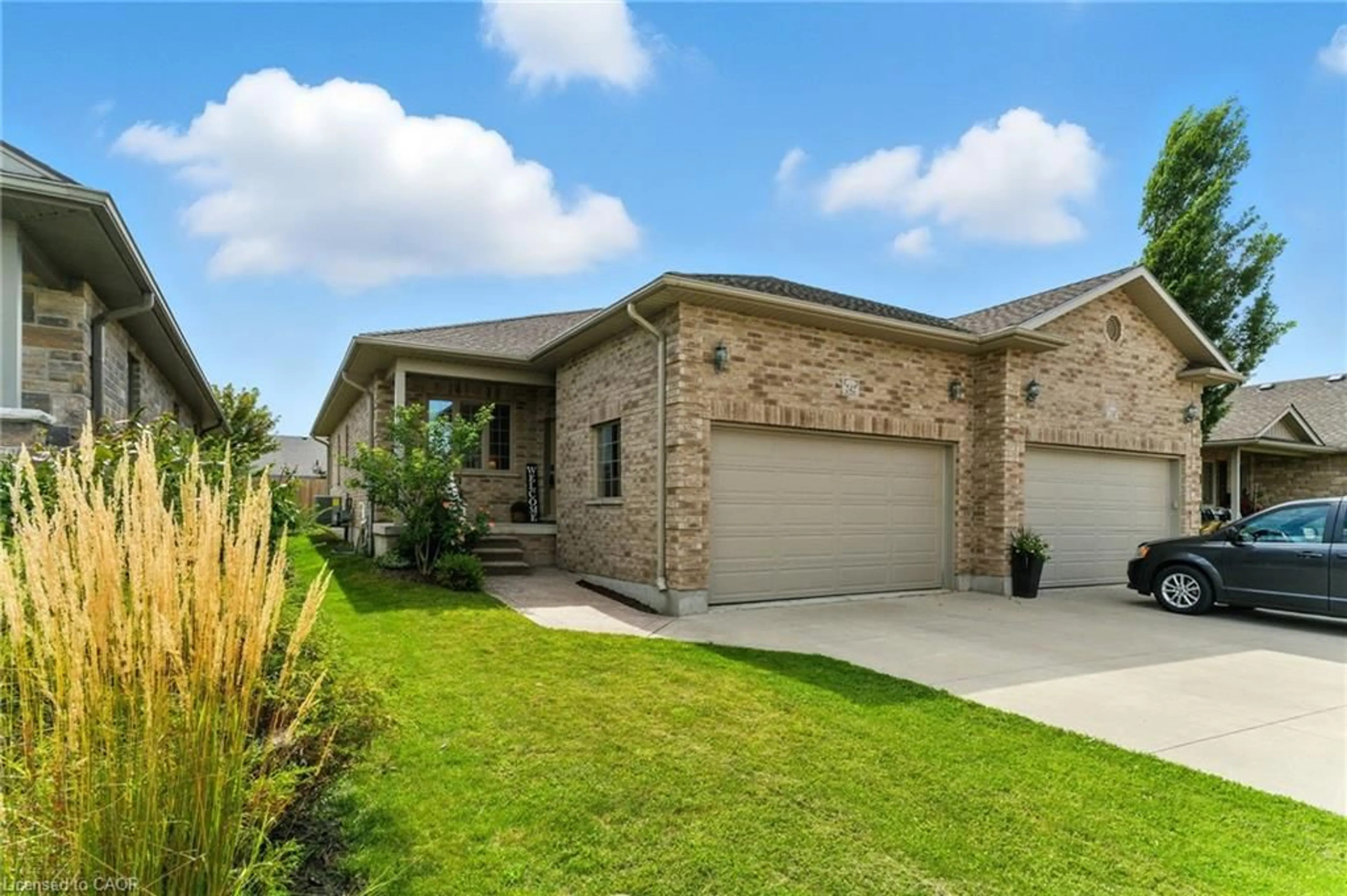 Home with brick exterior material, street for 242 Hutton St, Listowel Ontario N4W 0C1