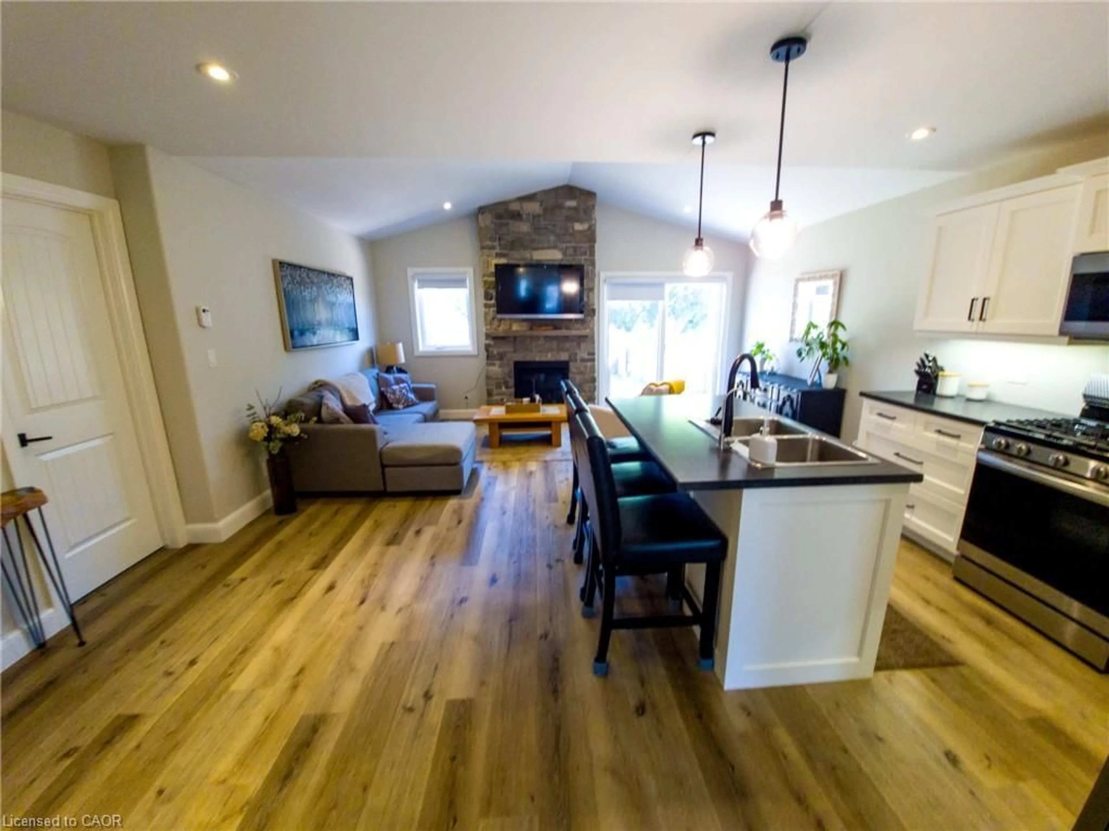 Open concept kitchen, wood/laminate floor for 822 Main St, Port Dover Ontario N0A 1N0