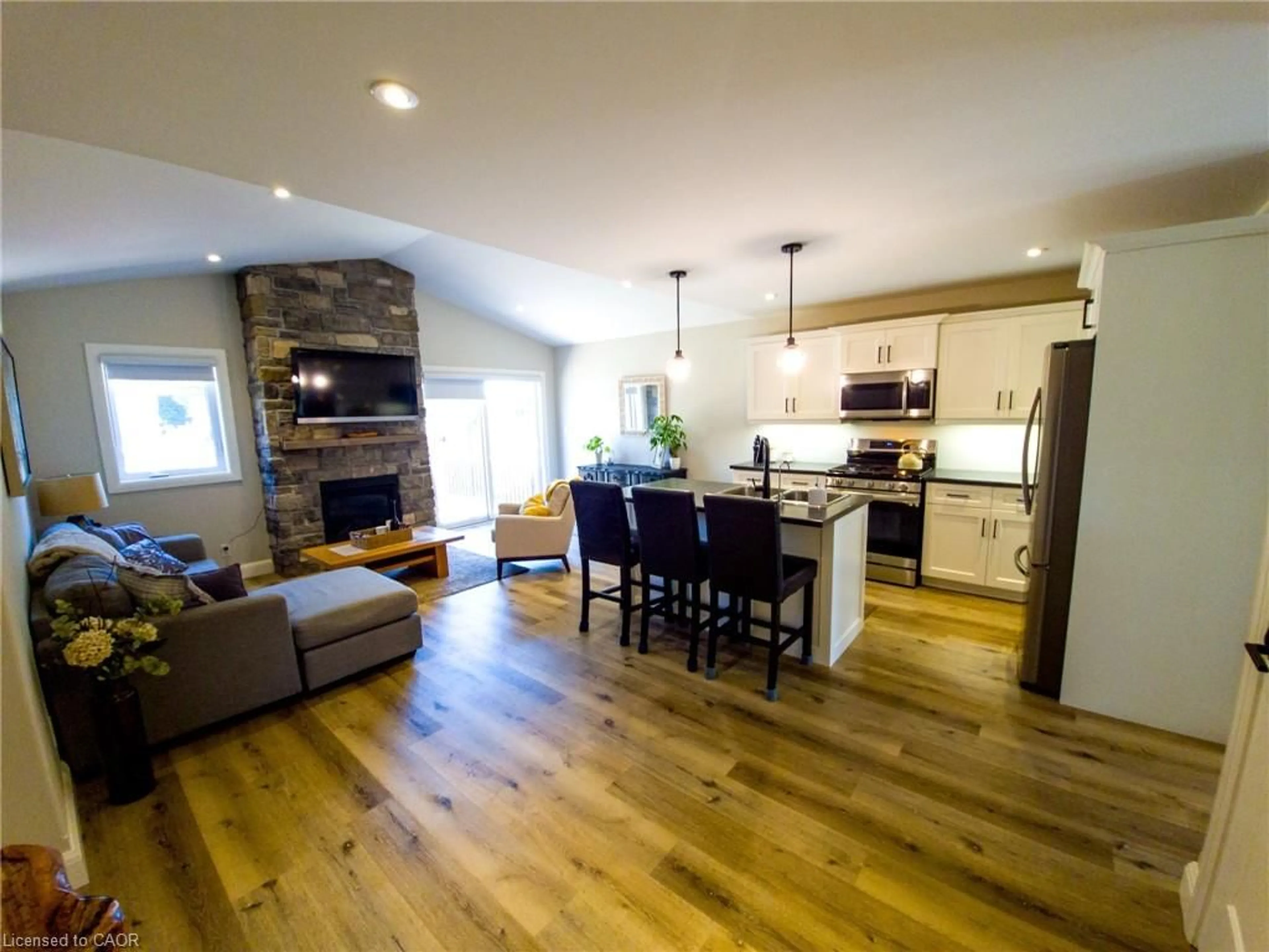 Open concept kitchen, wood/laminate floor for 822 Main St, Port Dover Ontario N0A 1N0