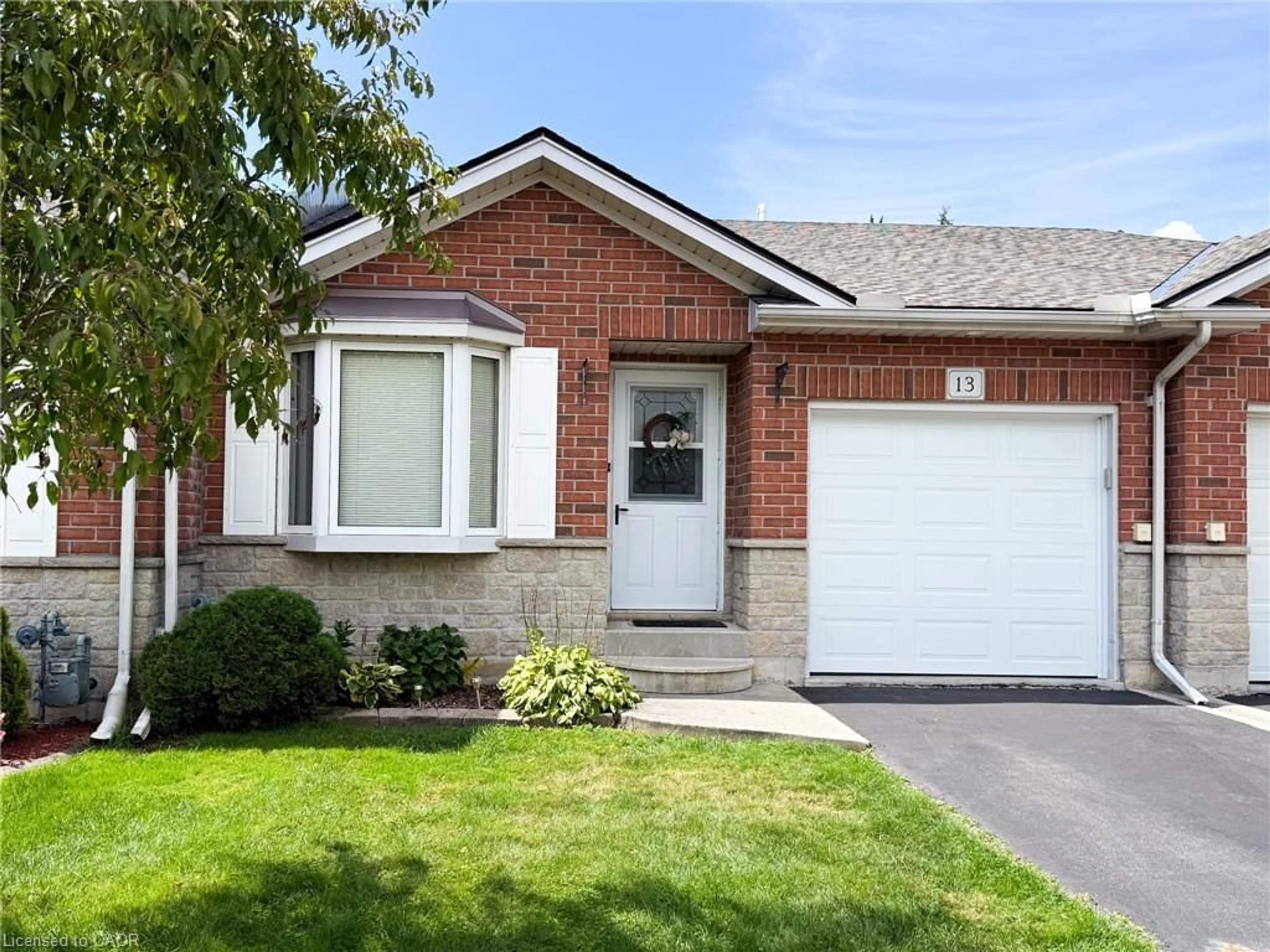 Home with brick exterior material, street for 13 Clonmel Lane, Port Dover Ontario N0A 1N1