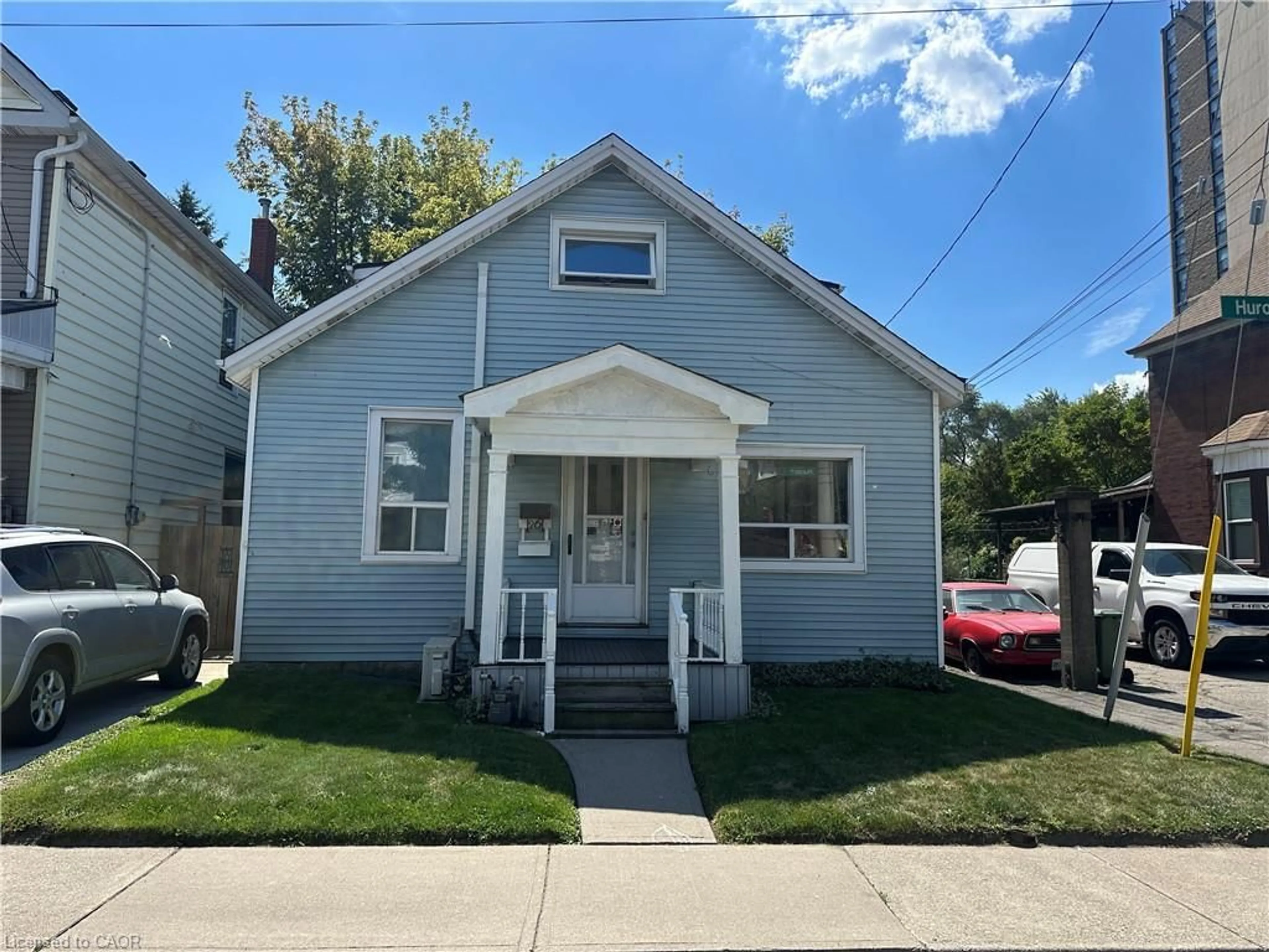 Home with vinyl exterior material, street for 26 Huron St, Hamilton Ontario L8L 2S2