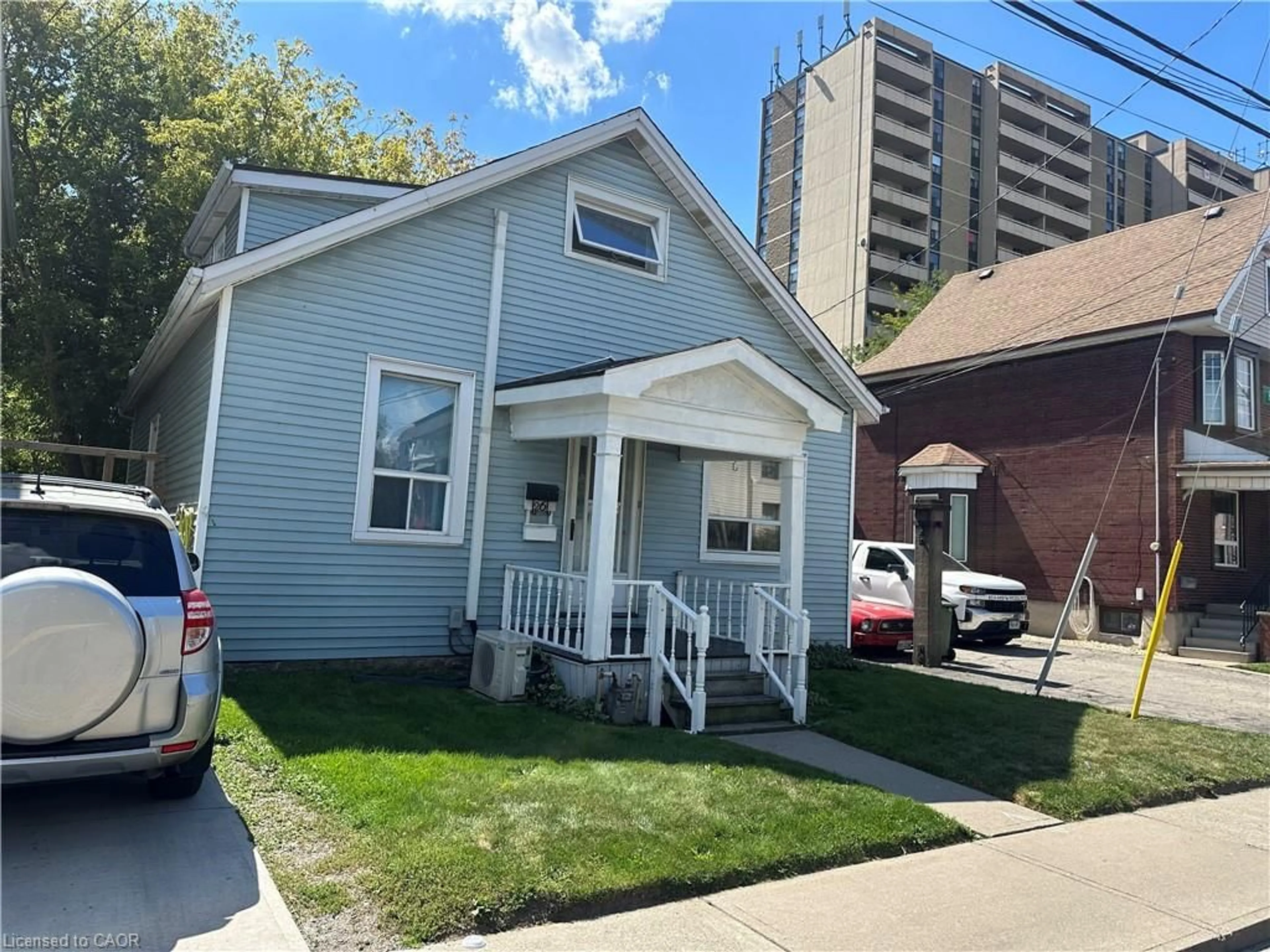 Home with vinyl exterior material, street for 26 Huron St, Hamilton Ontario L8L 2S2
