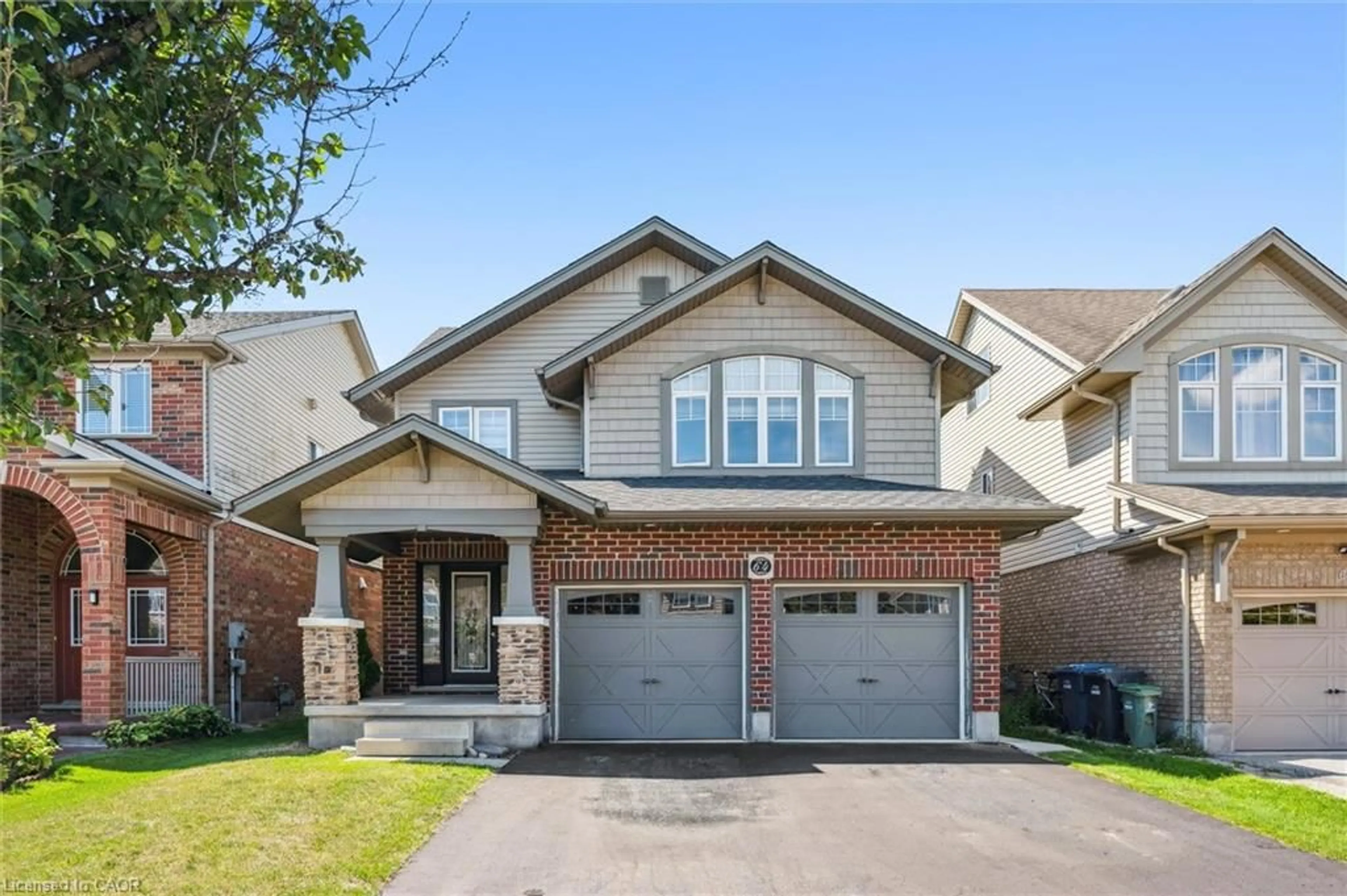 Home with brick exterior material, street for 64 Laughland Lane, Guelph Ontario N1L 0C6