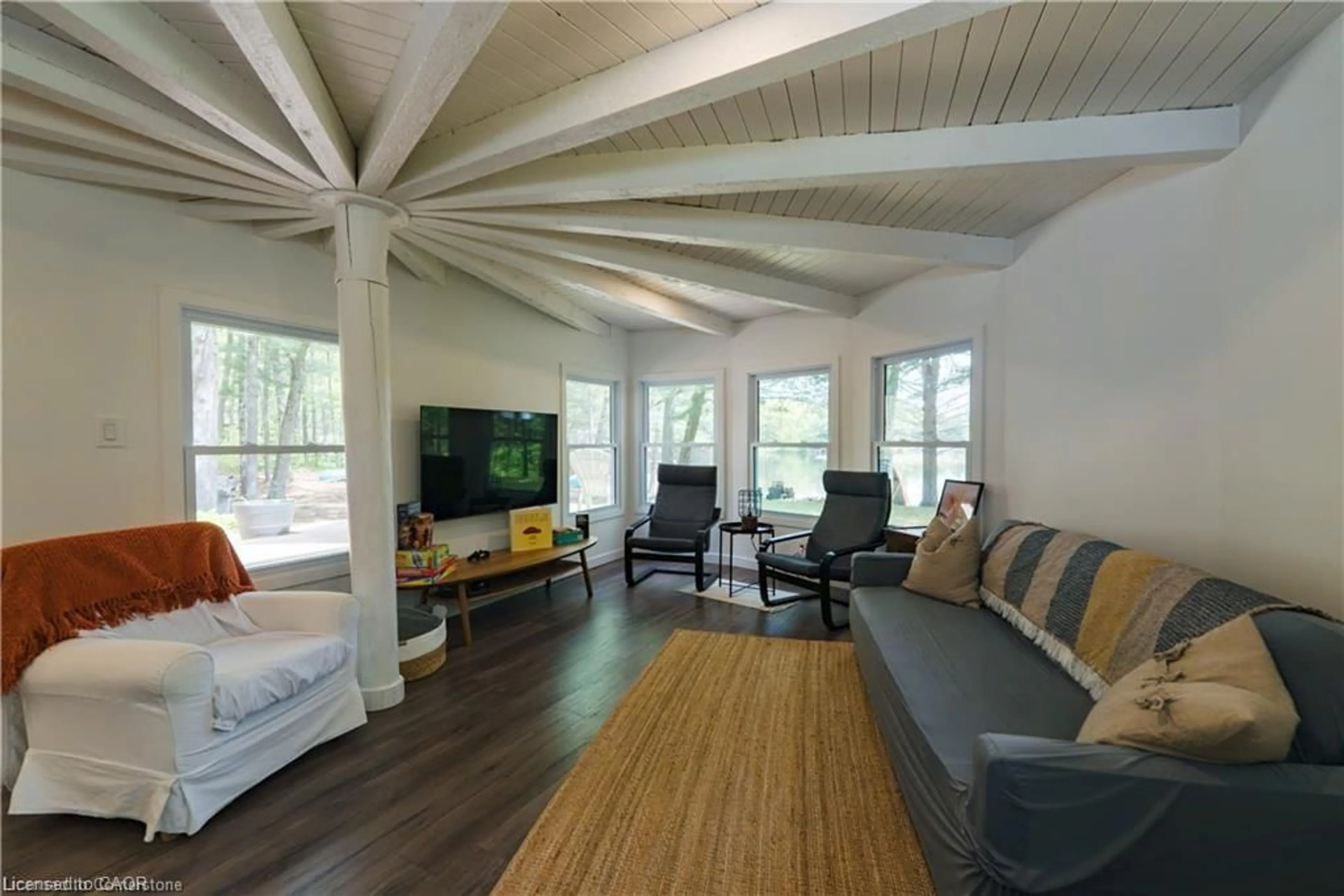 Living room with furniture, wood/laminate floor for 847 West Kosh Rd, Havelock Ontario K0L 2H0