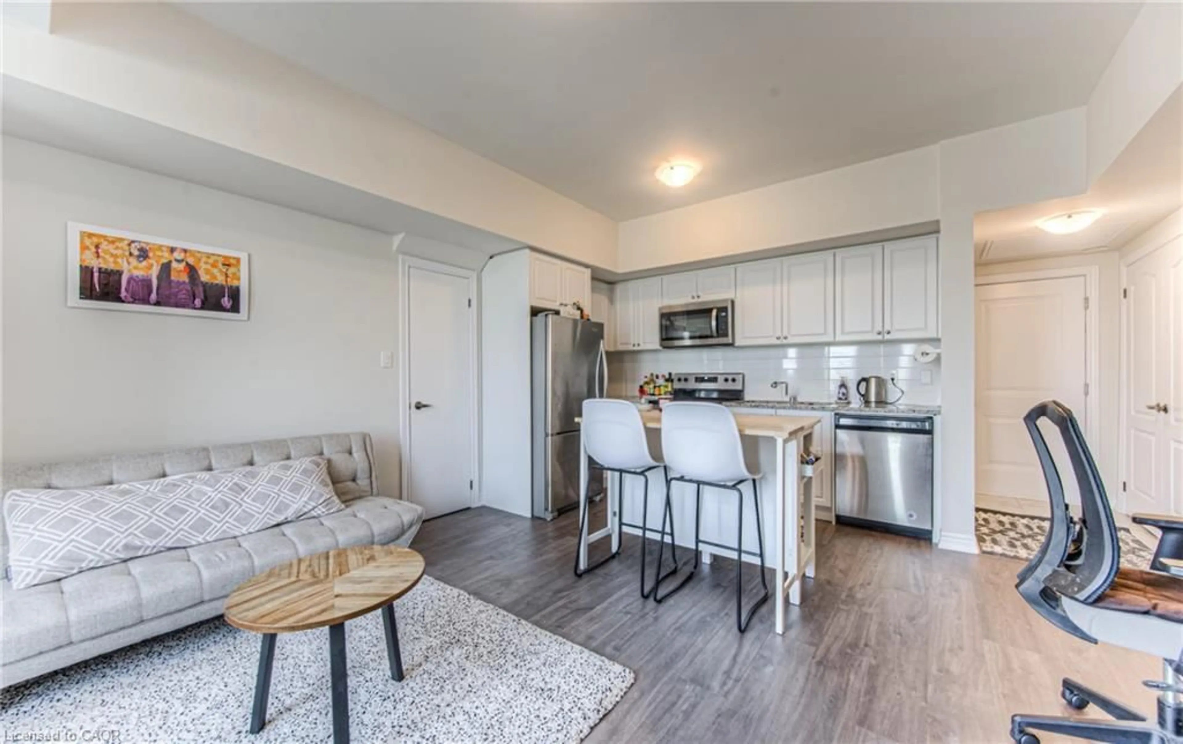 Open concept kitchen, wood/laminate floor for 120 Watson Pky #2, Guelph Ontario N1E 0P6