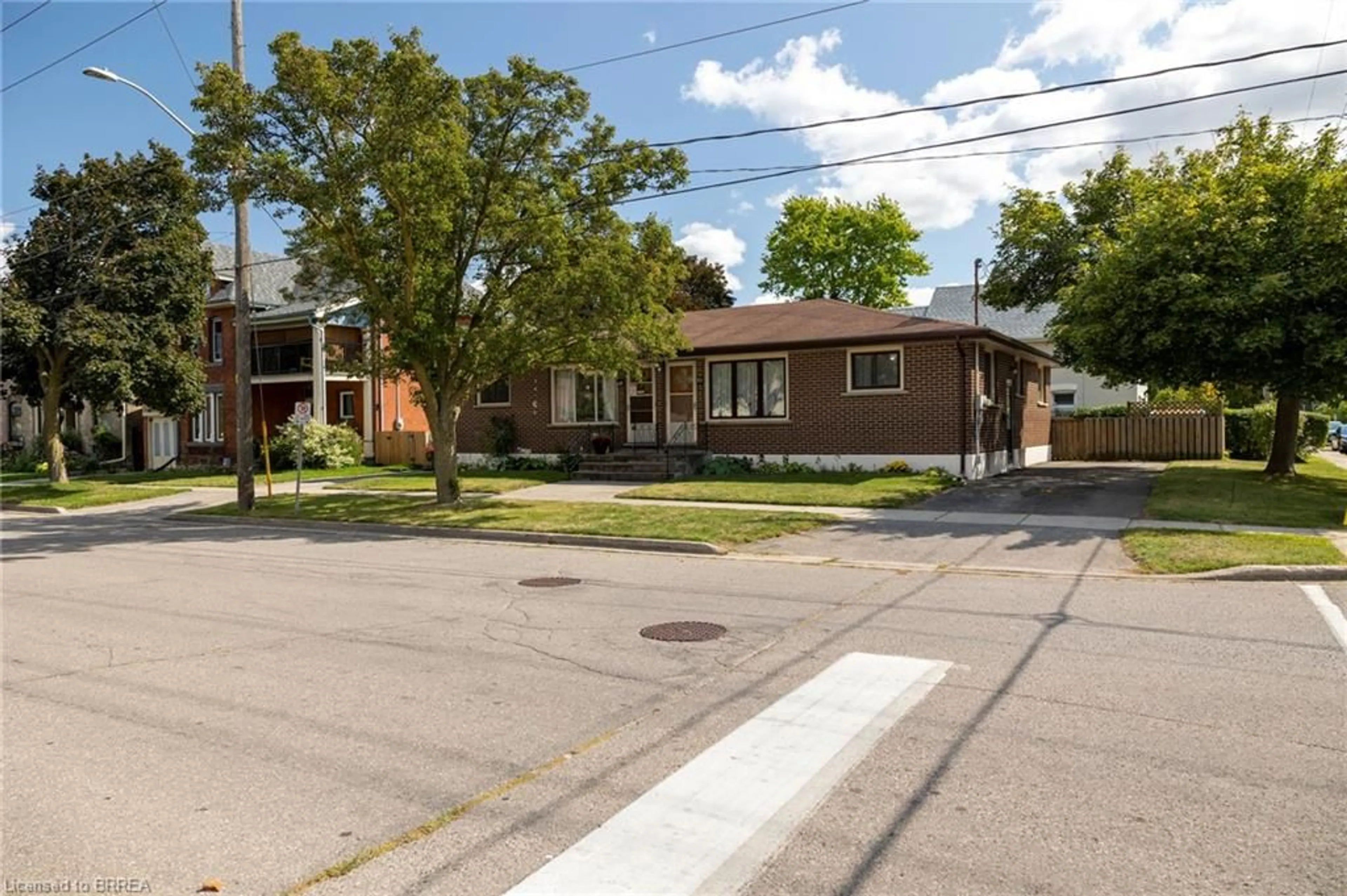 Home with brick exterior material, street for 93-95 East Ave, Brantford Ontario N3S 3L8
