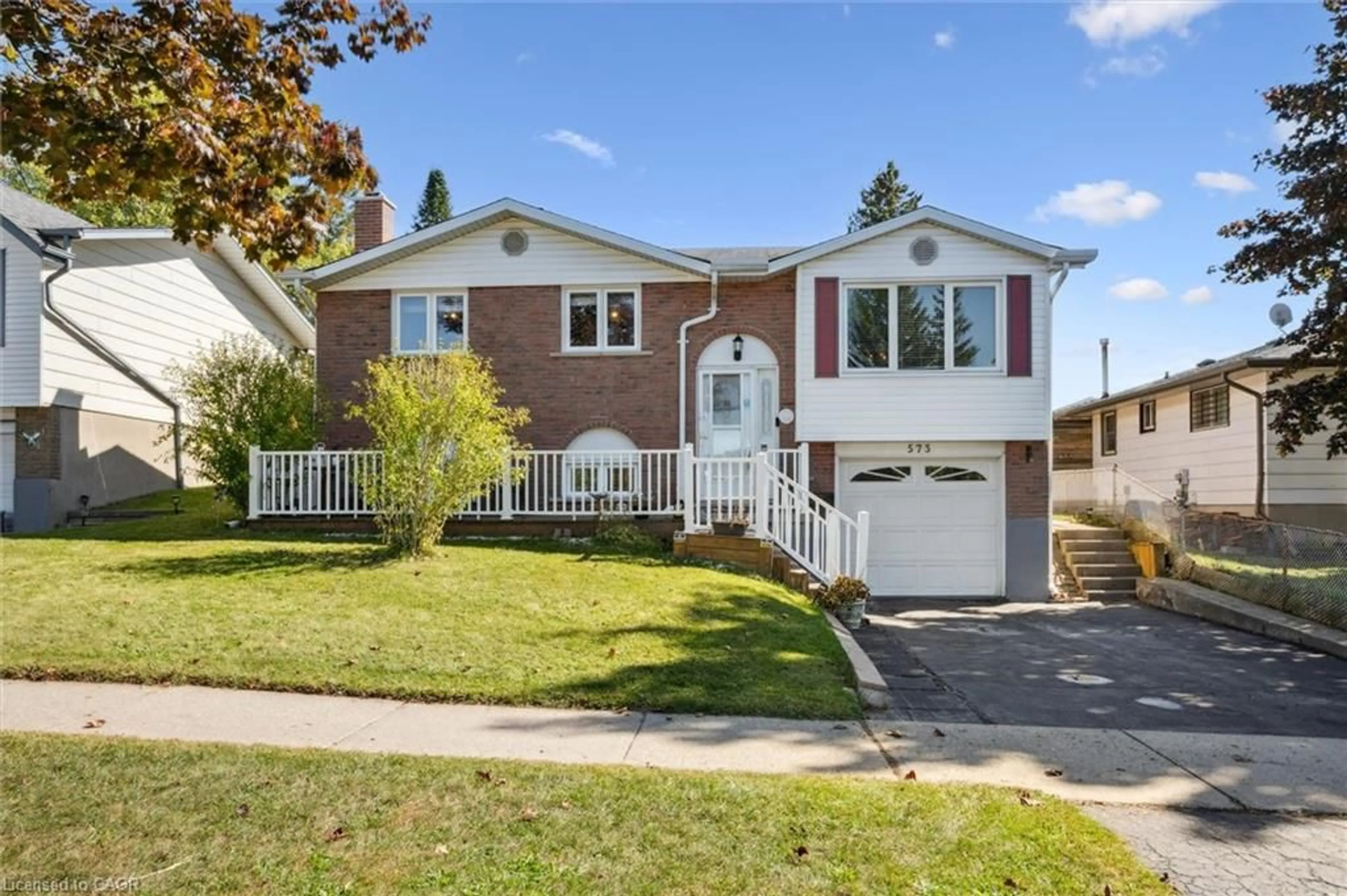 Home with vinyl exterior material, street for 573 Pioneer Dr, Kitchener Ontario N2P 1P4