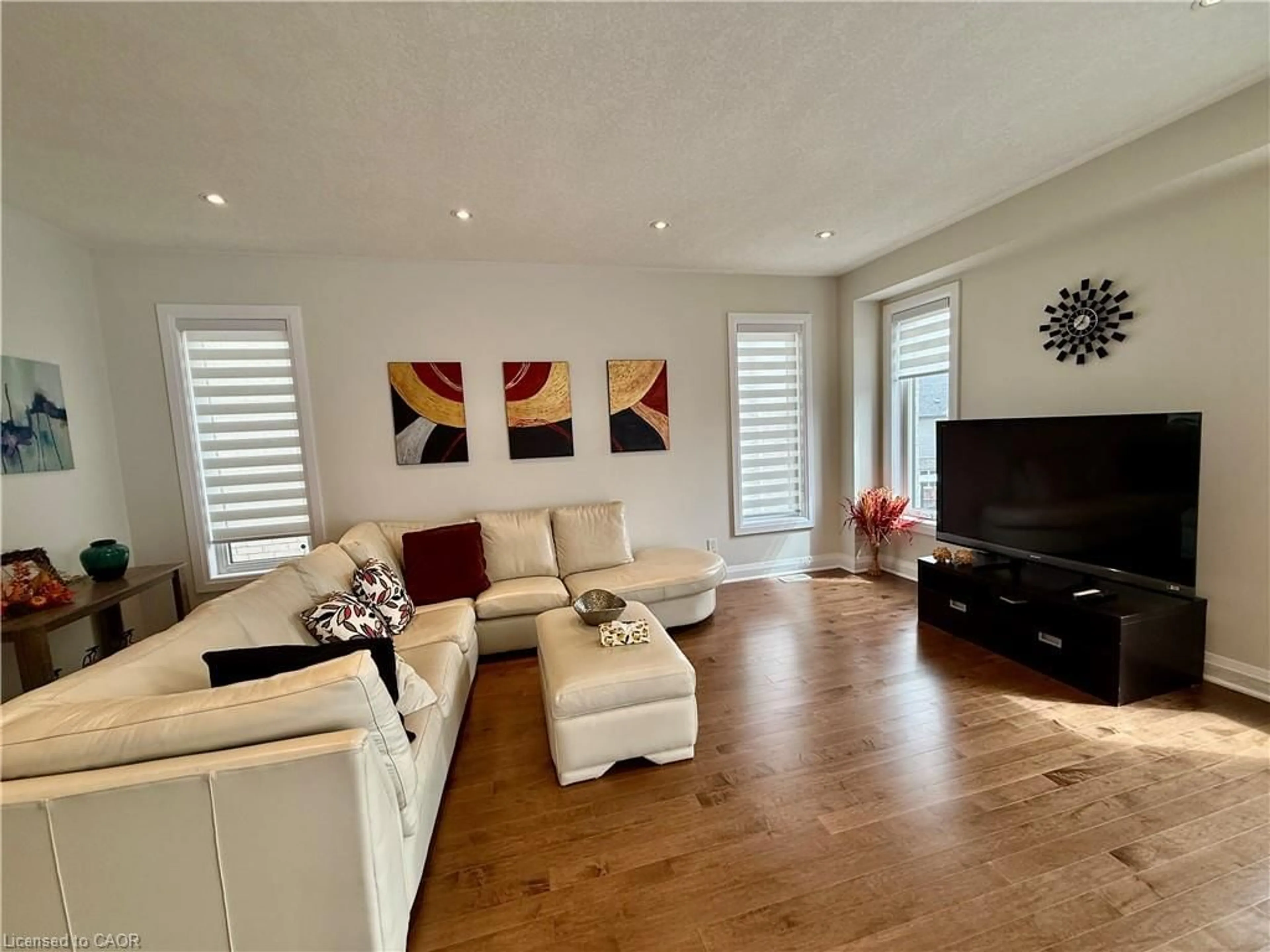 Living room with furniture, wood/laminate floor for 296 Chokecherry Crescent Cres, Waterloo Ontario N2V 0H1