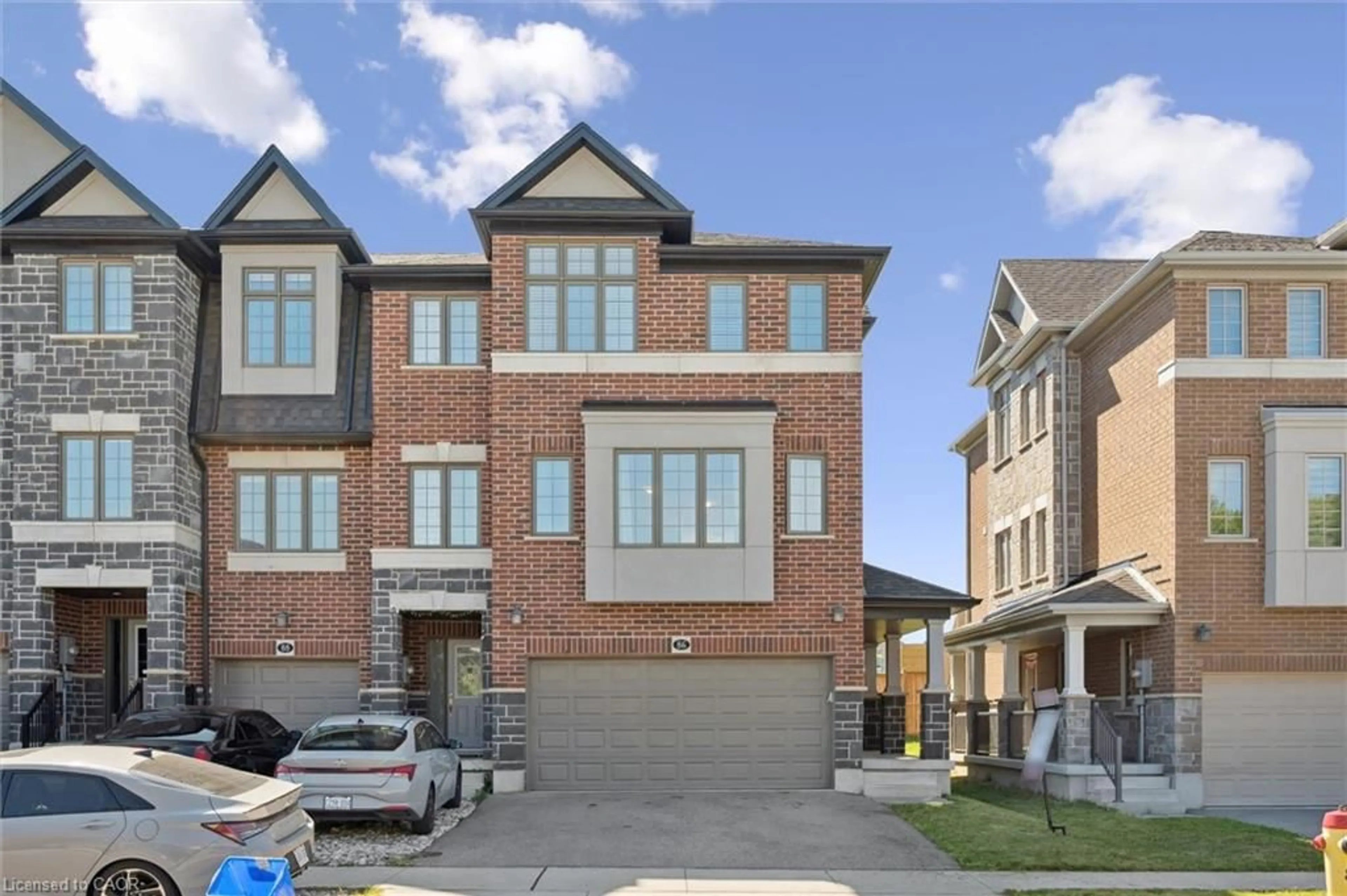 Home with brick exterior material, street for 86 Monarch Woods Dr, Kitchener Ontario N2P 0K1