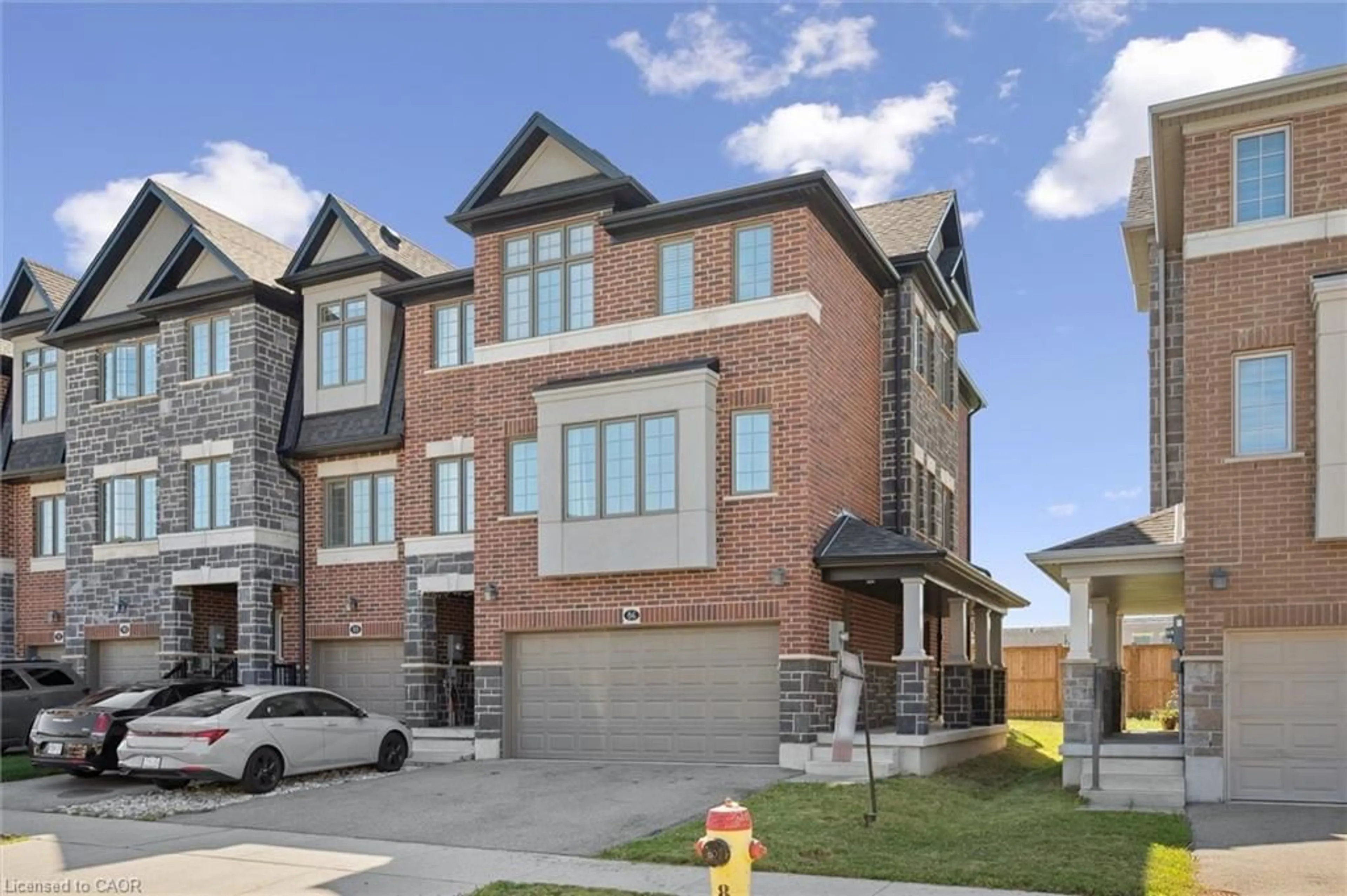 Home with brick exterior material, street for 86 Monarch Woods Dr, Kitchener Ontario N2P 0K1