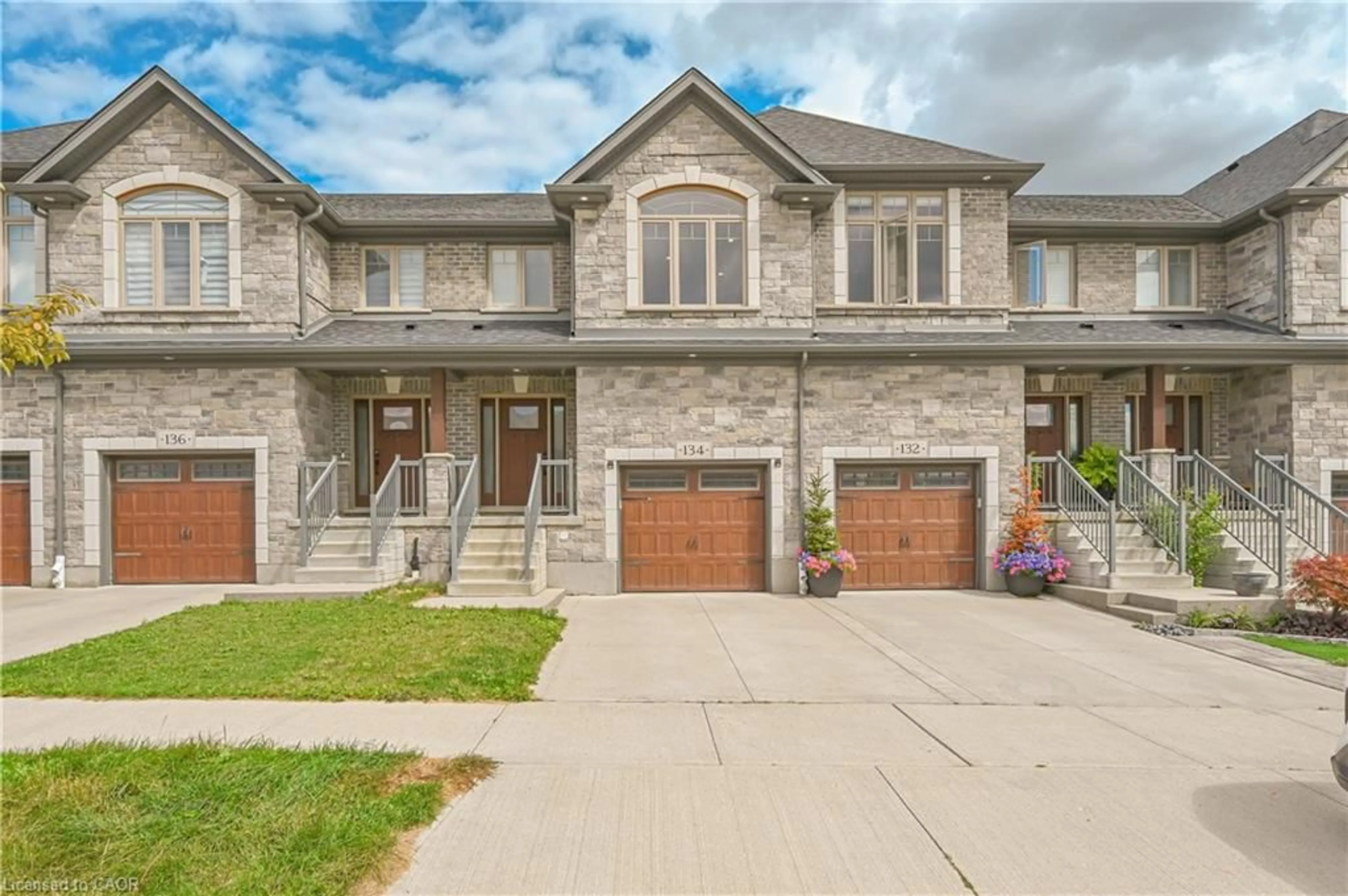 Home with brick exterior material, street for 134 Hollybrook Trail, Kitchener Ontario N2R 0M7