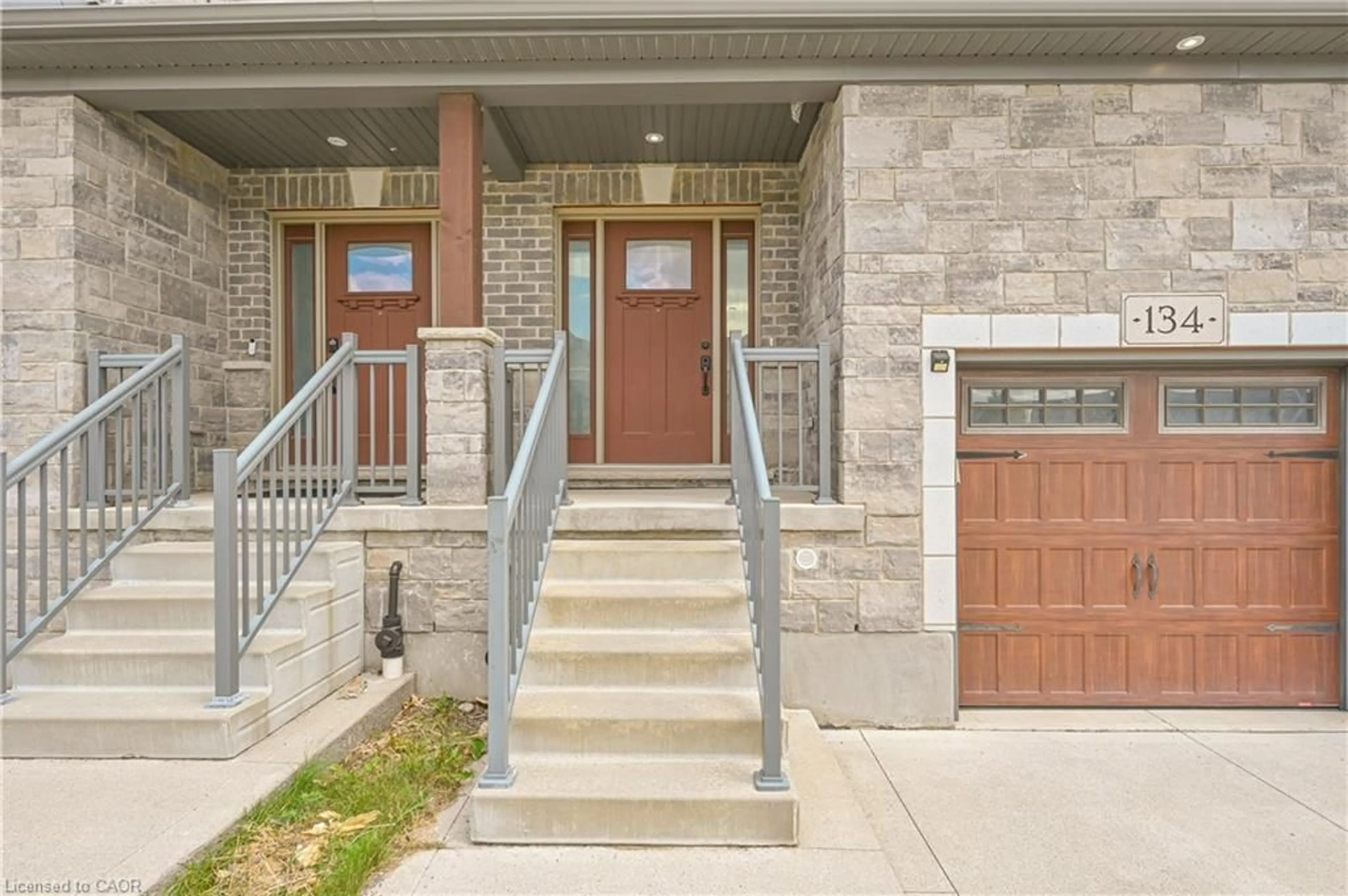 Home with brick exterior material, street for 134 Hollybrook Trail, Kitchener Ontario N2R 0M7
